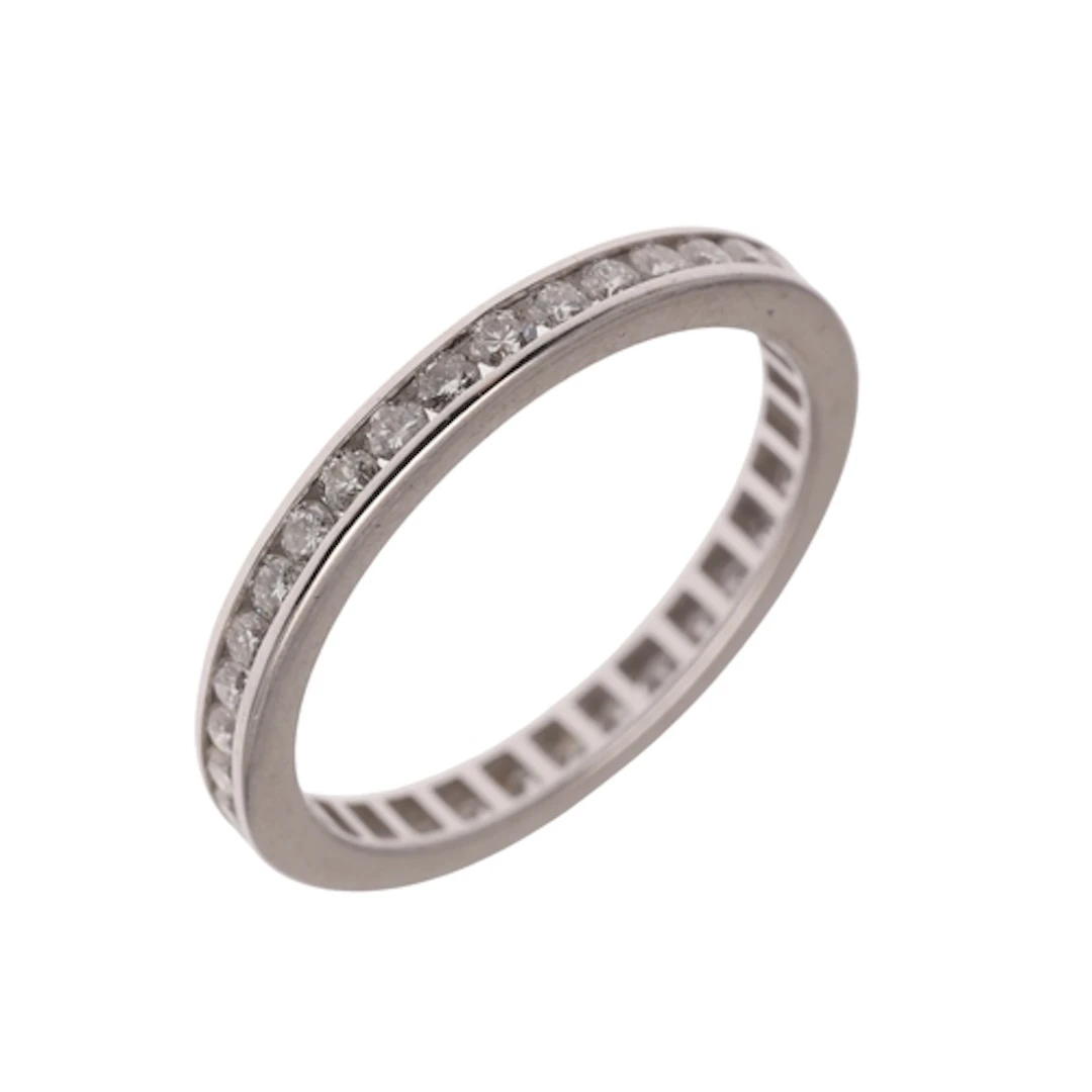 A DIAMOND FULL CIRCLE ETERNITY RING. mounted with circular-c...