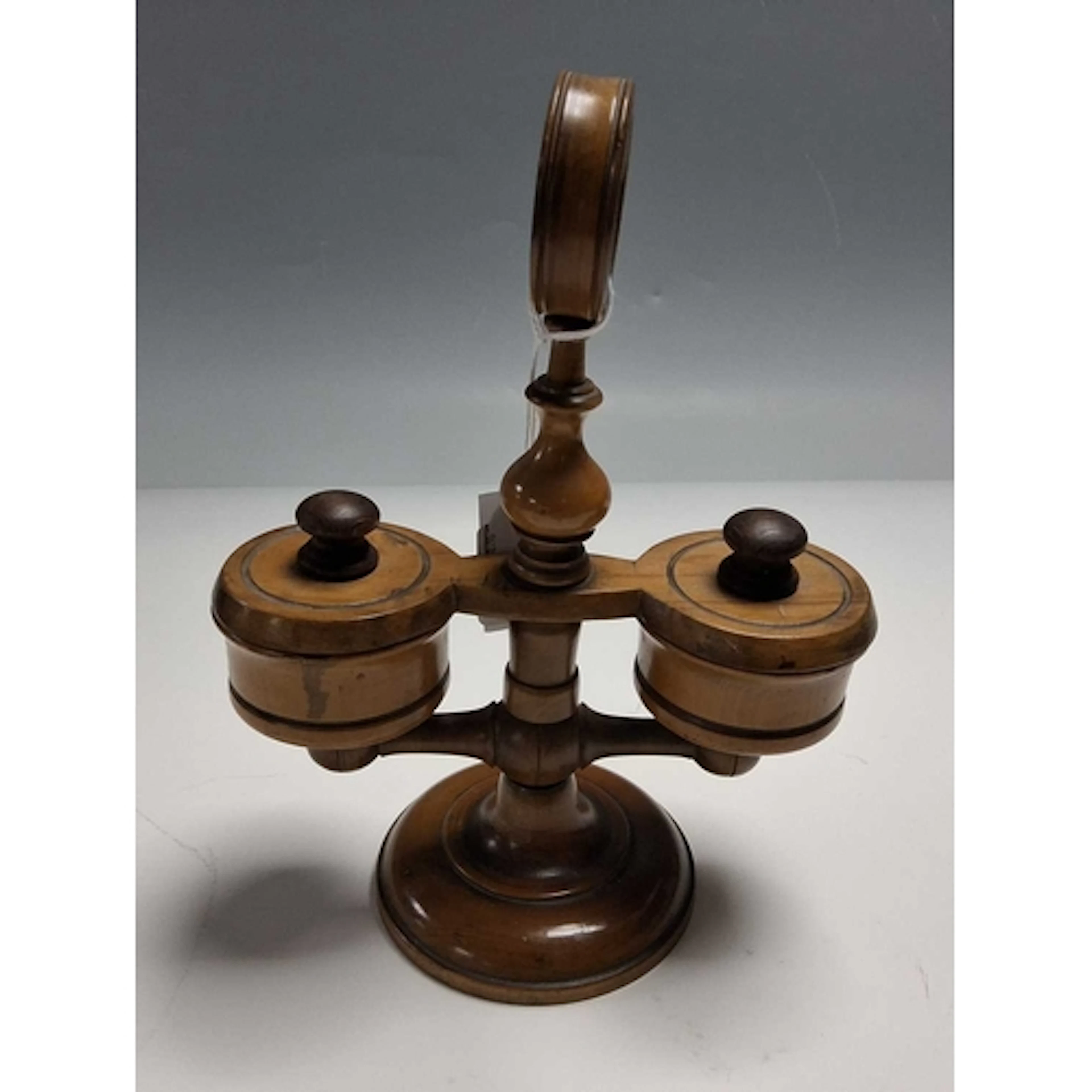 AN OLIVE WOOD CONDIMENT SET, having two bowls for salt and p...