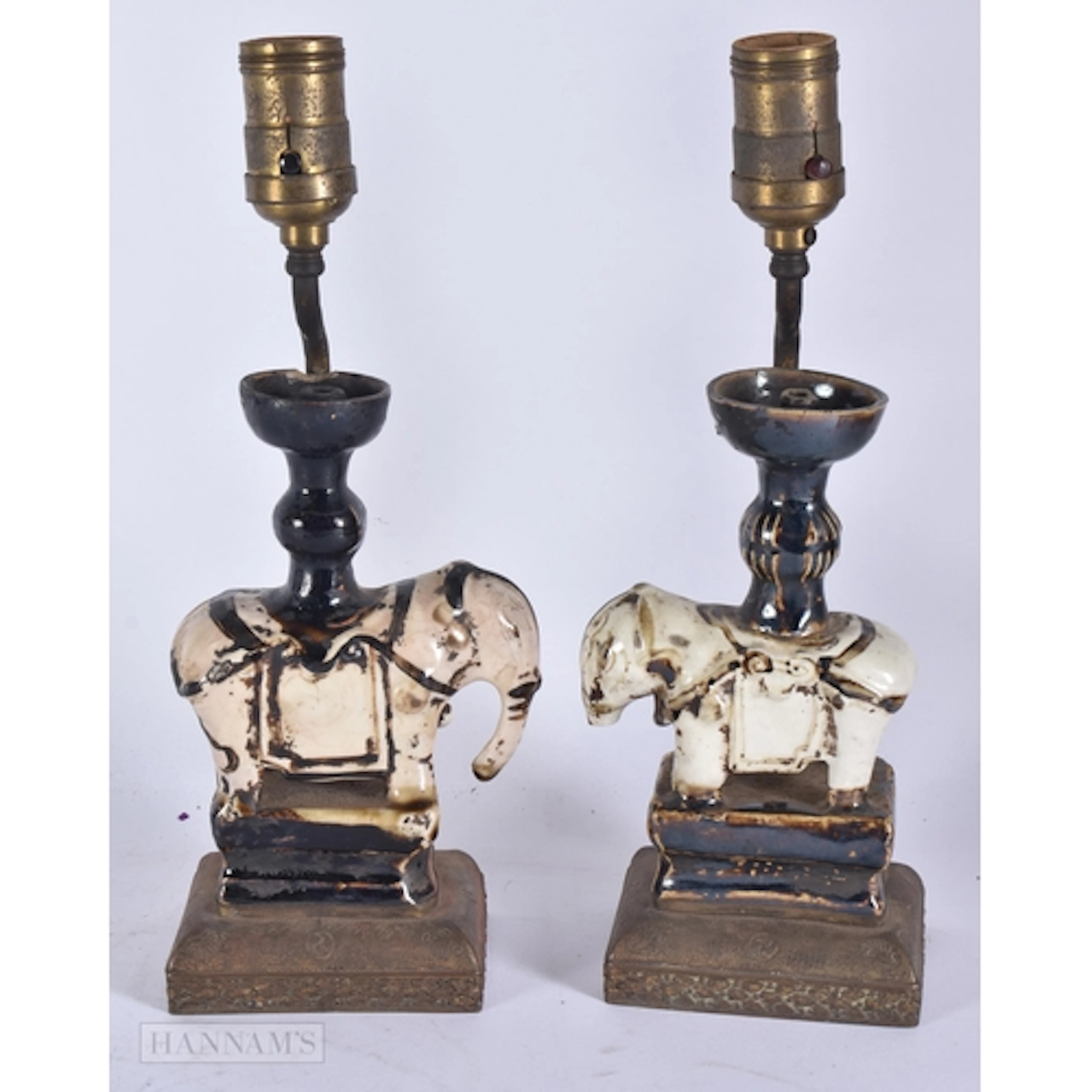 A PAIR OF CHINESE QING DYNASTY CIZHOU POTTERY ELEPHANT LAMPS...