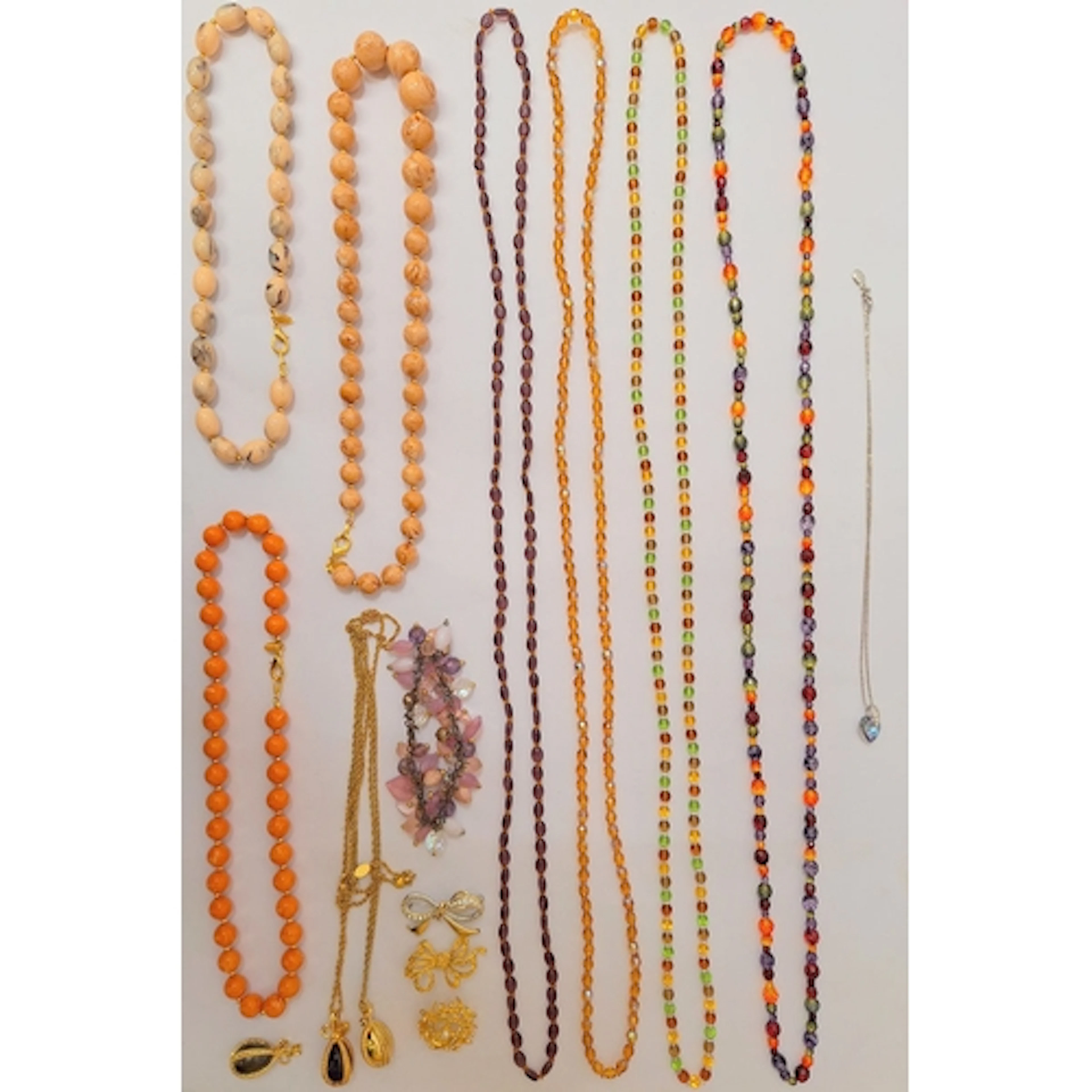 3 Pendant Necklaces, 2 gold tone, 1 silver tone, all with Jo...