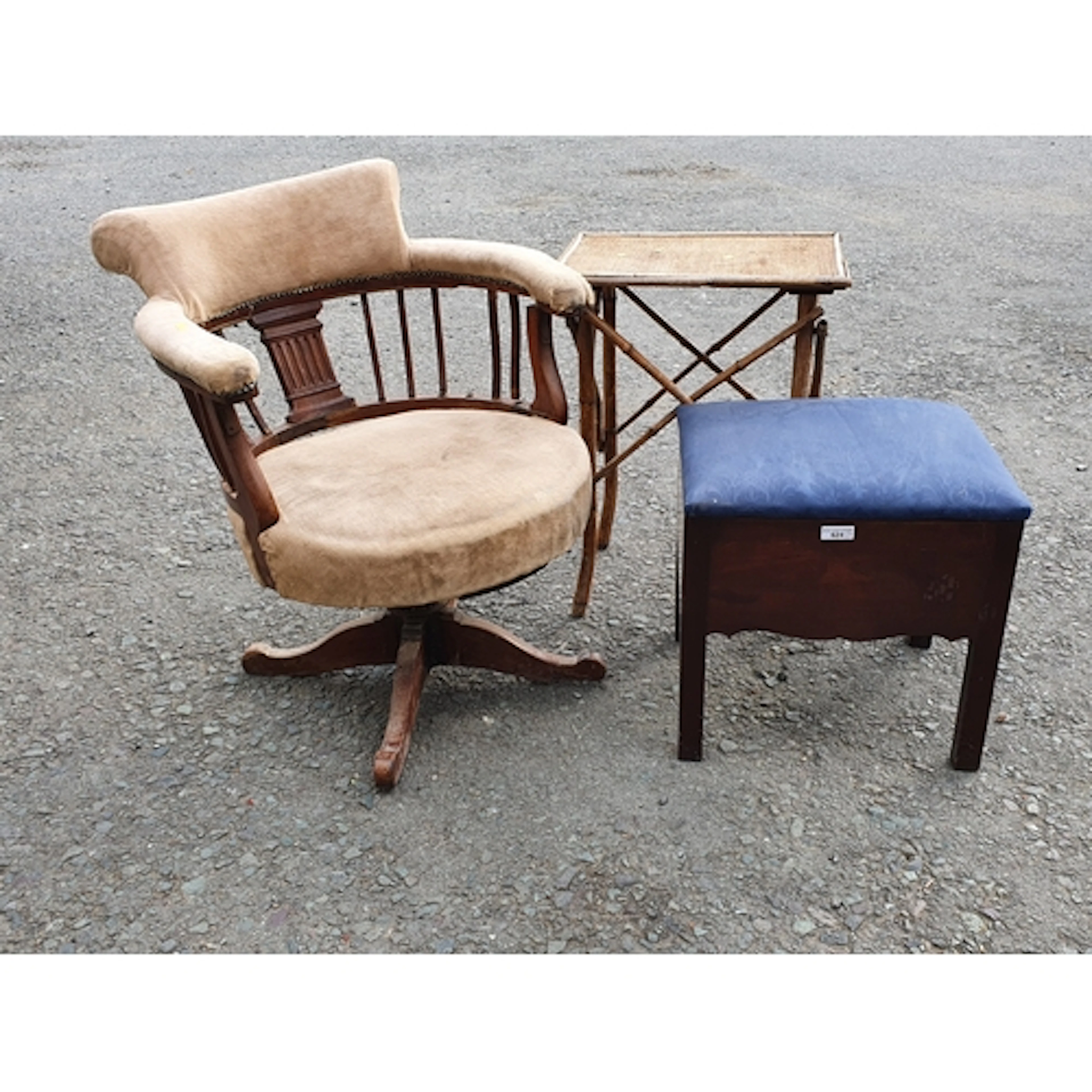 A mahogany upholstered Footstool, a cream upholstered swivel...