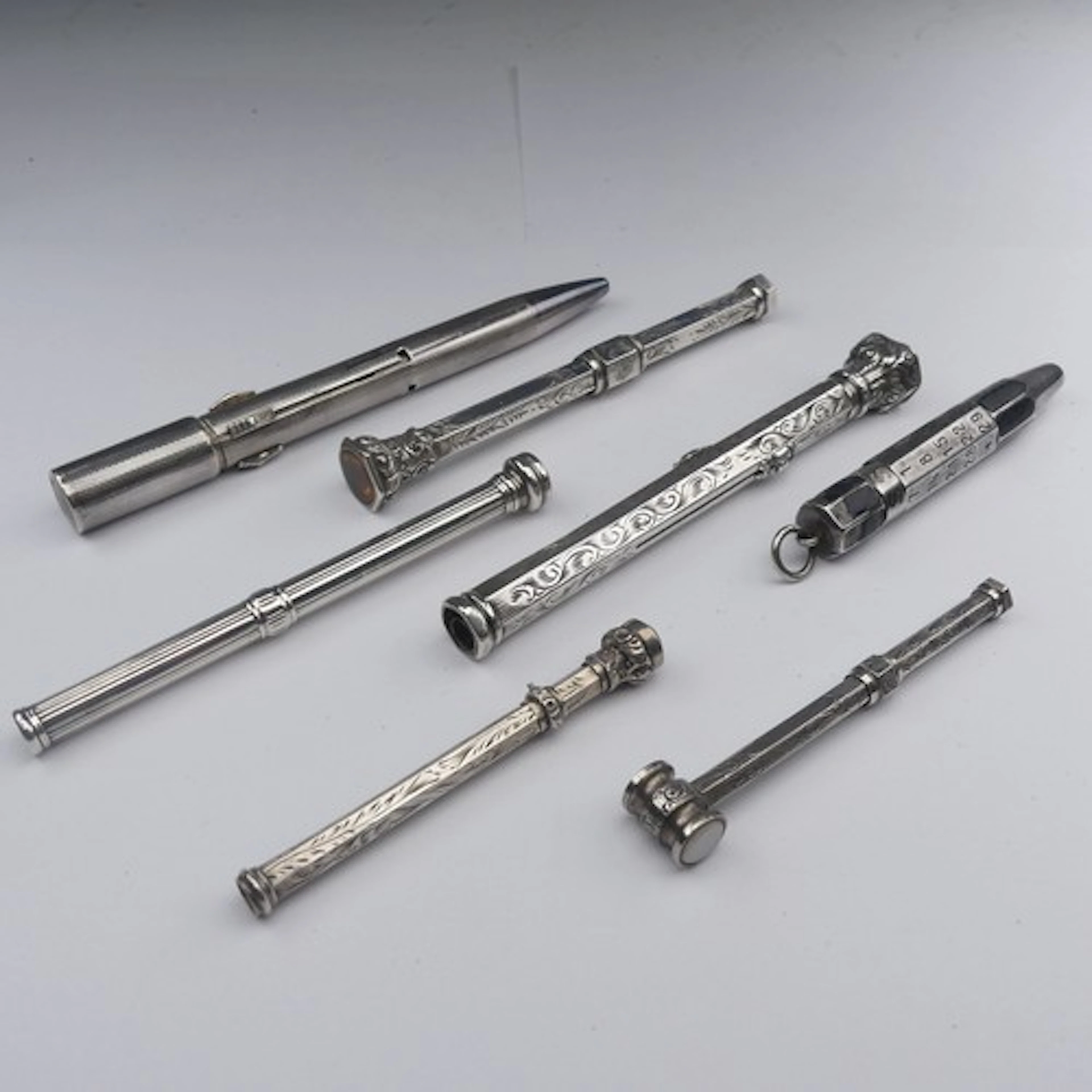 A silver propelling Pencil / Dip Pen Combination, the finial...