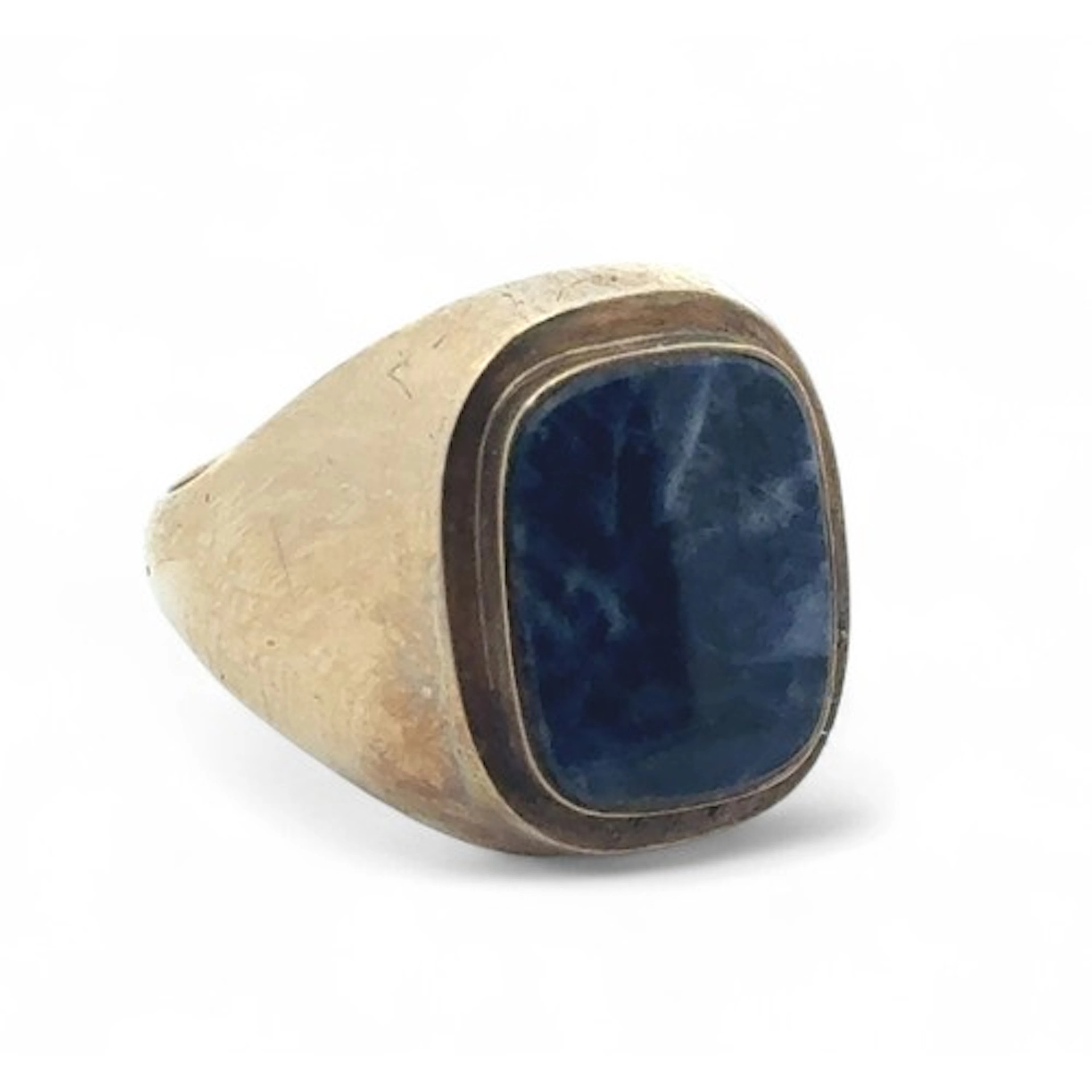 A sodalite signet ring, size Q. Unmarked yellow metal mount ...