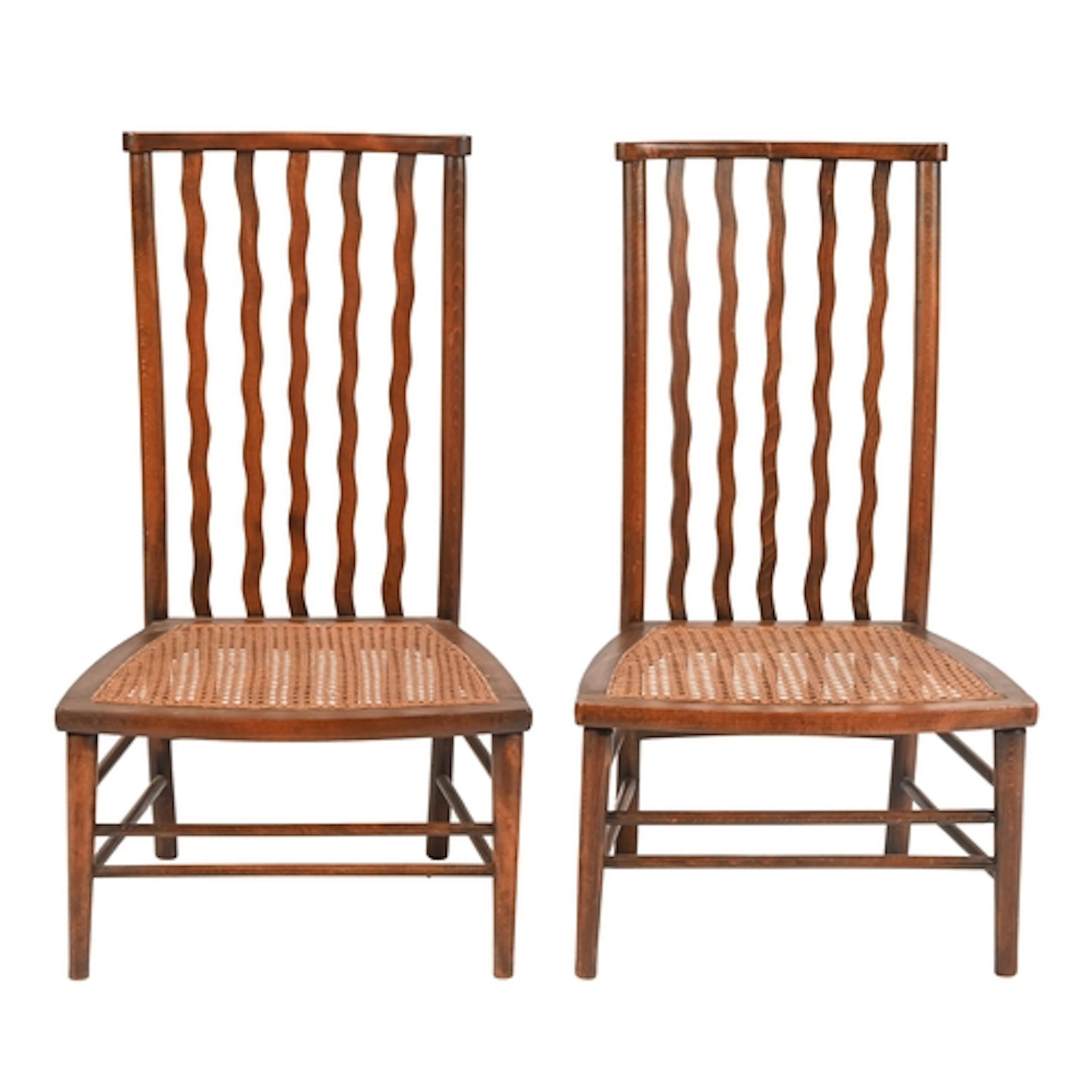 A pair of Arts & Crafts beech chairs, after a design by ...