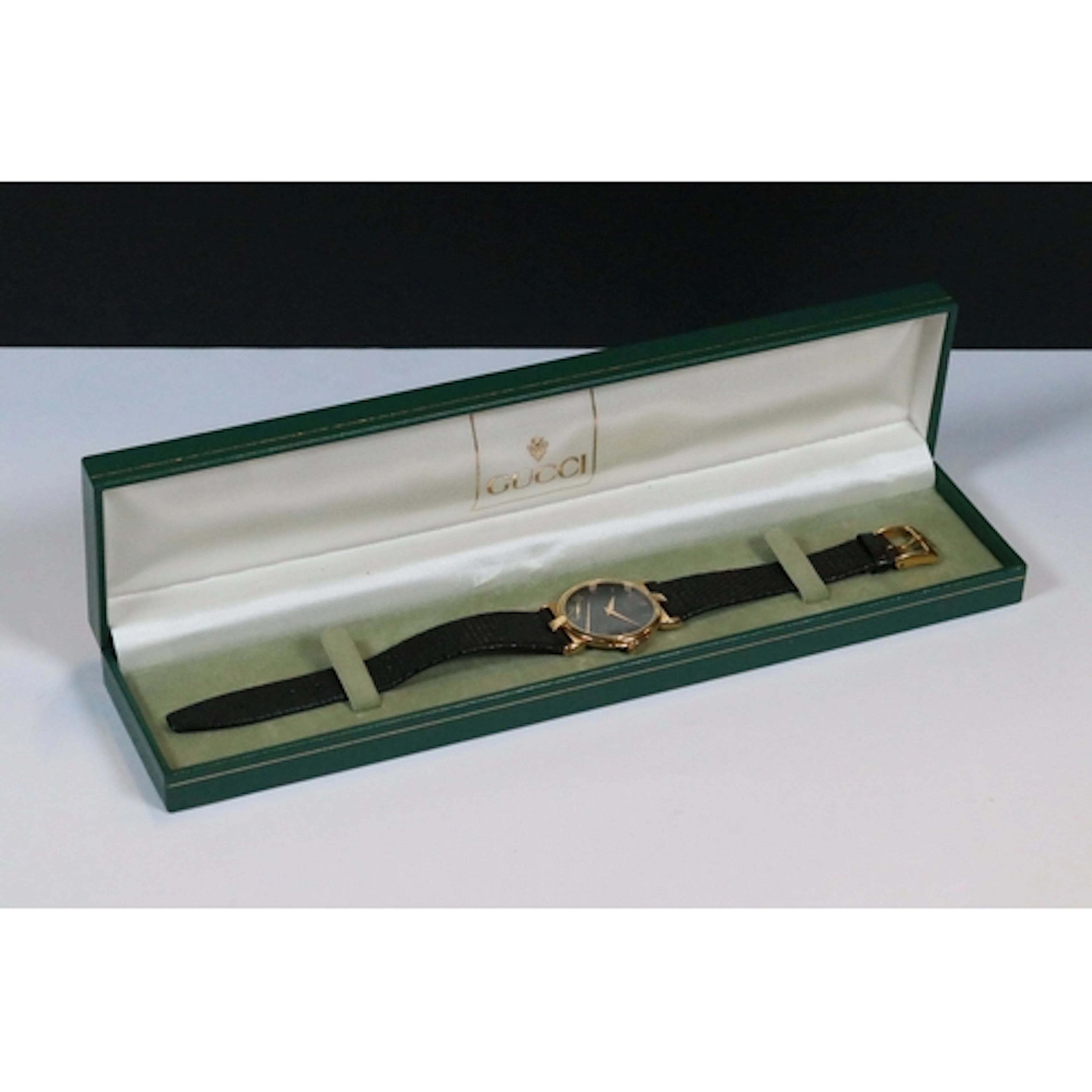 Boxed Gucci Timepieces quartz wrist watch, with black leathe...