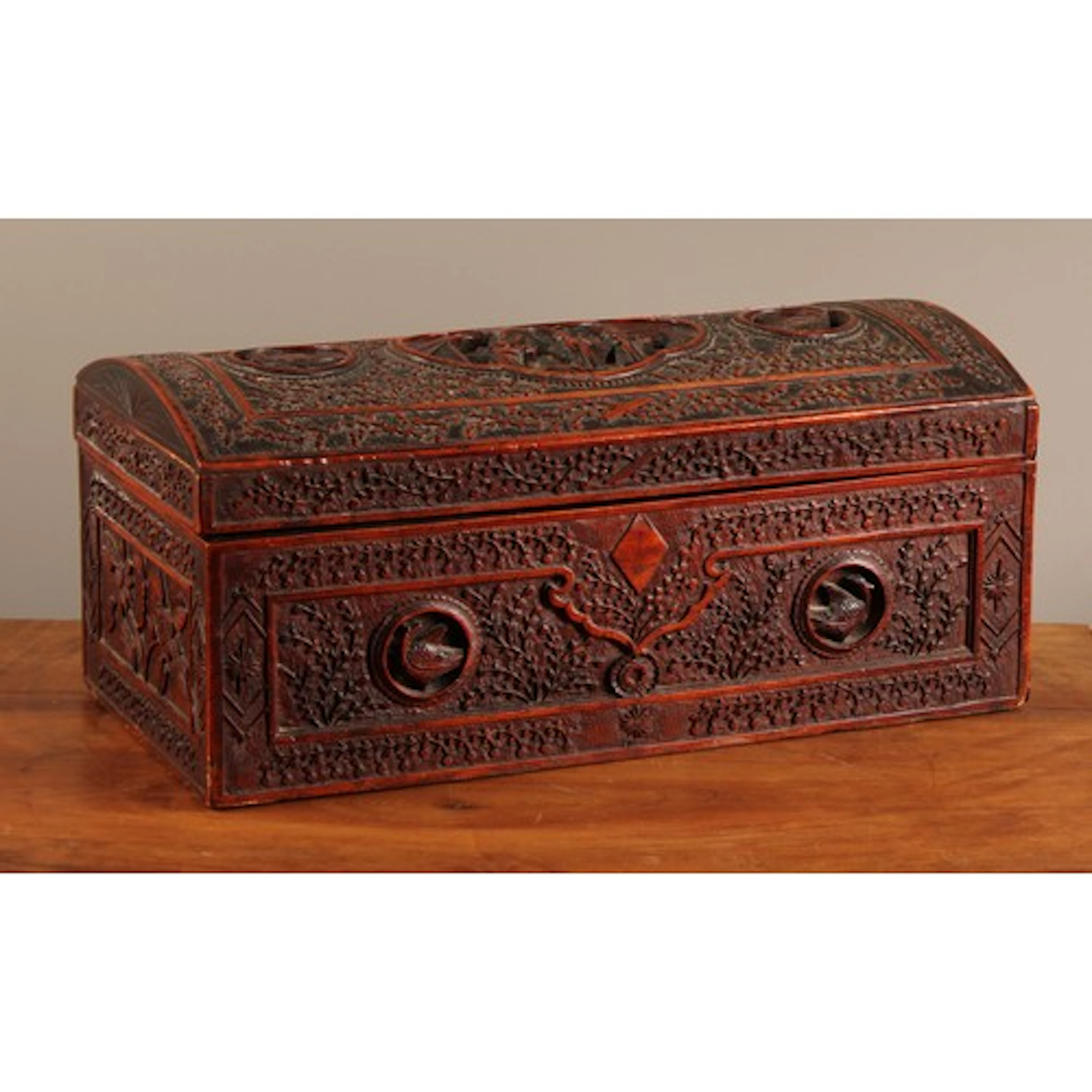 A Chinese sandalwood domed rectangular box, carved in the Ca...