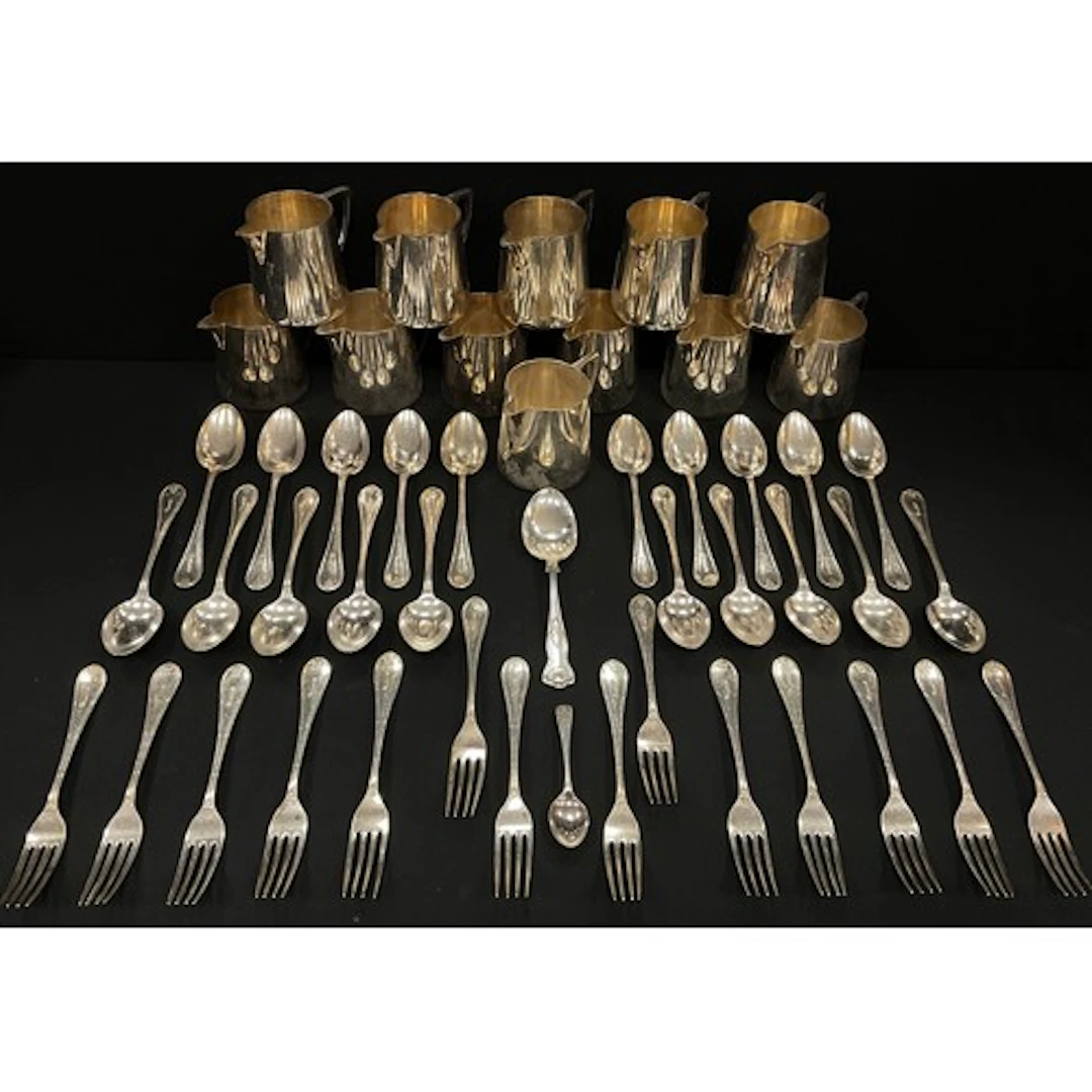 A collection of silver plated Walker & Hall Sheffield milk j...