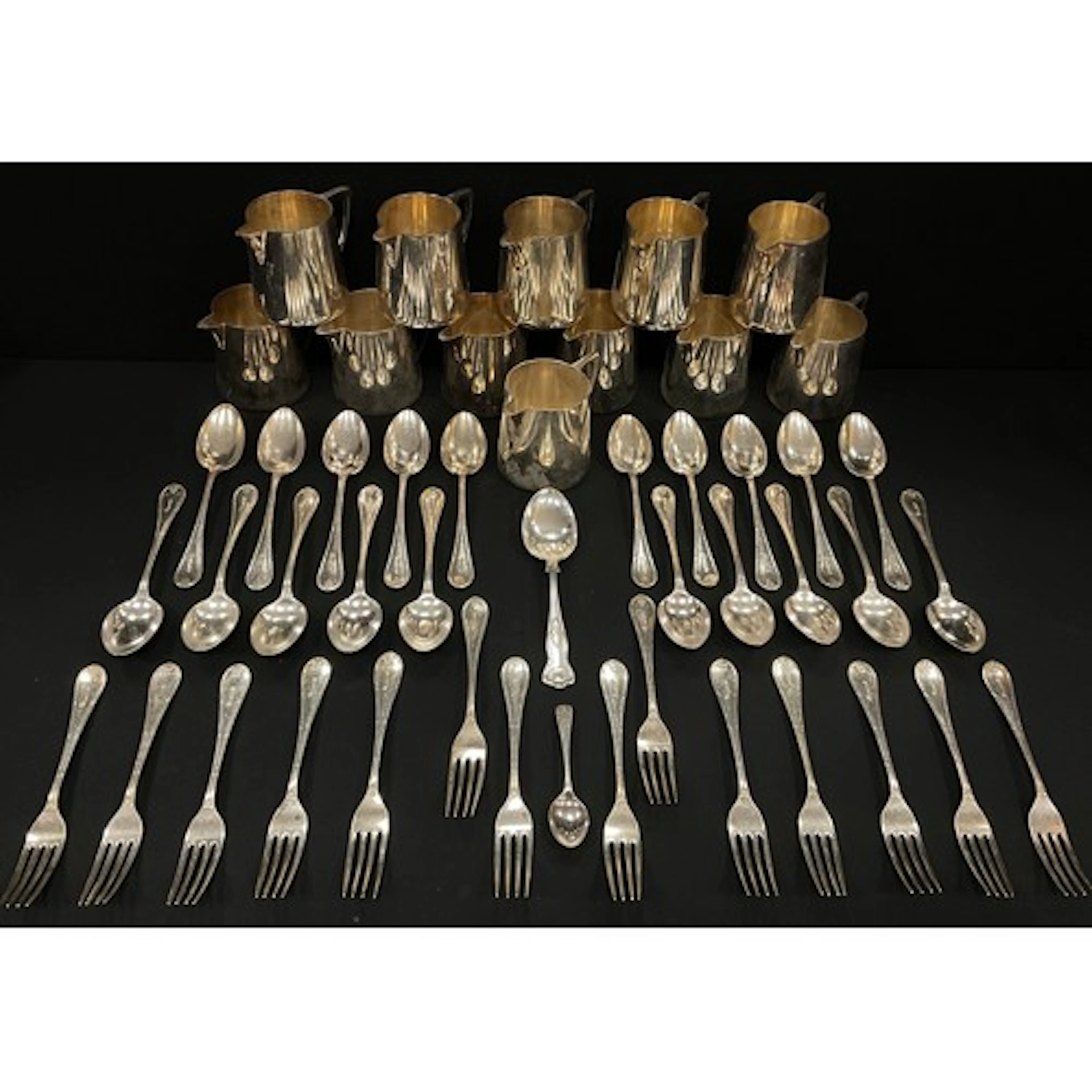 A collection of silver plated Walker & Hall Sheffield milk j...