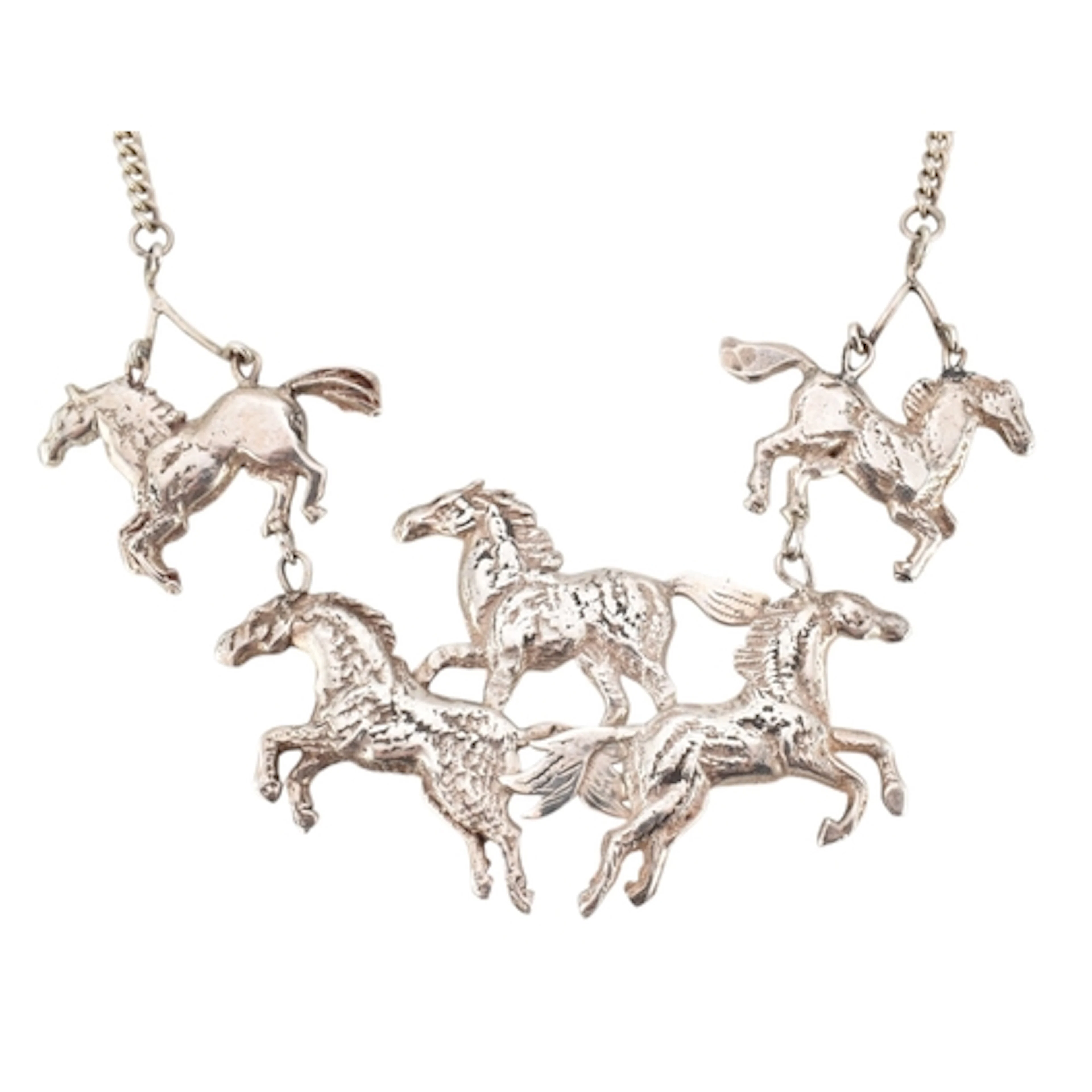 A 1980s hallmarked silver statement multi horse pendant neck...