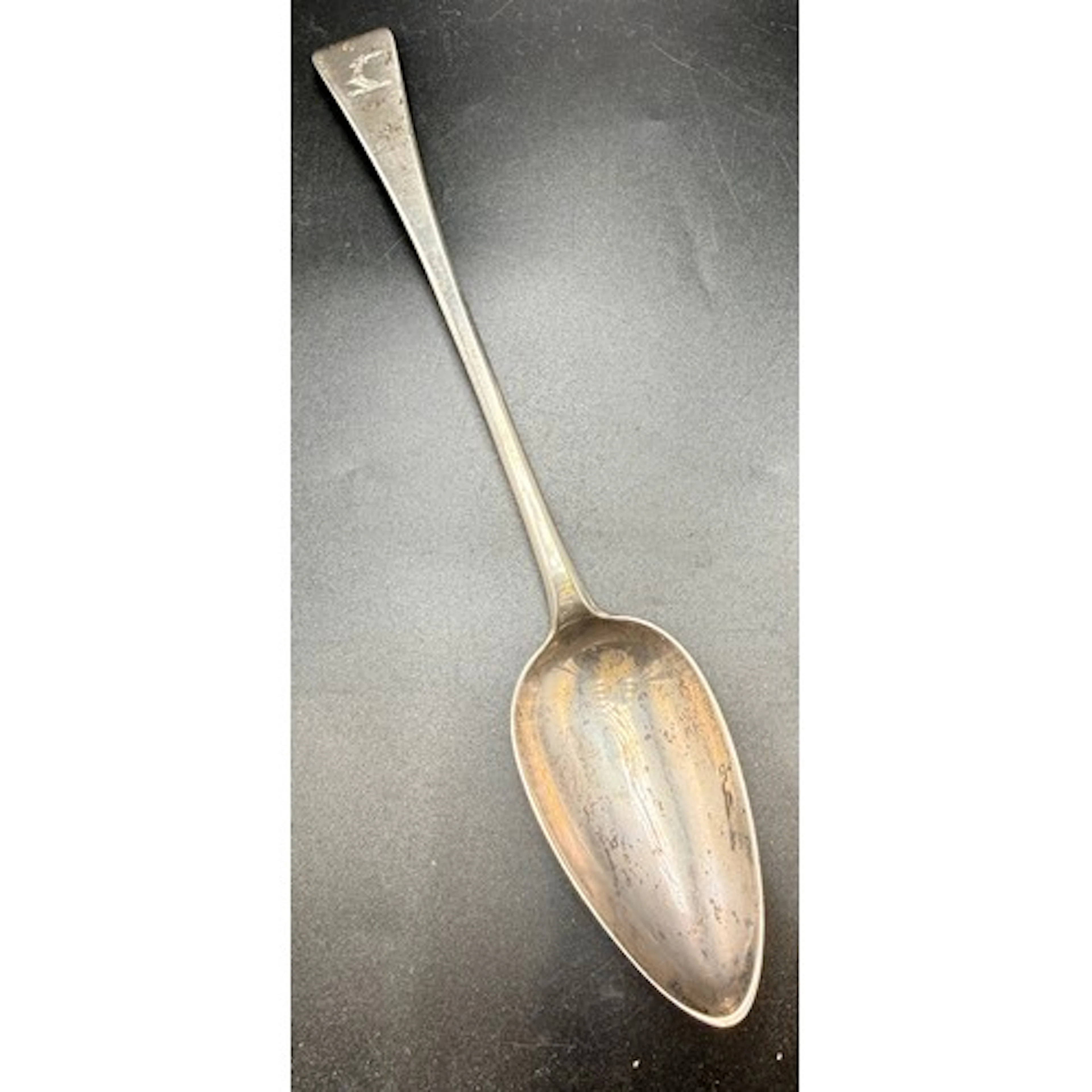 An 18thC silver basting spoon. In very good condition with c...