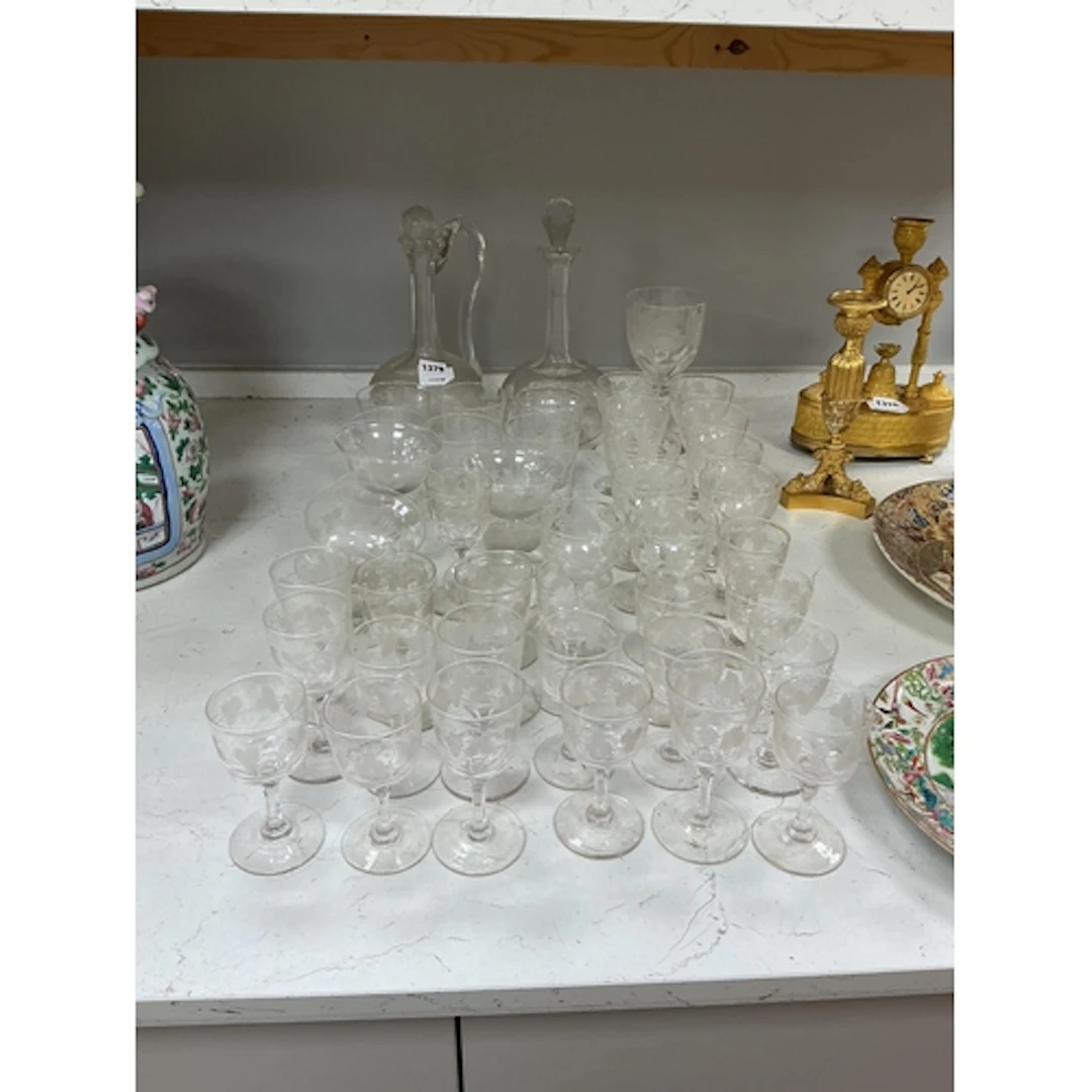 A part suite of Victorian vine engraved glasses to include t...