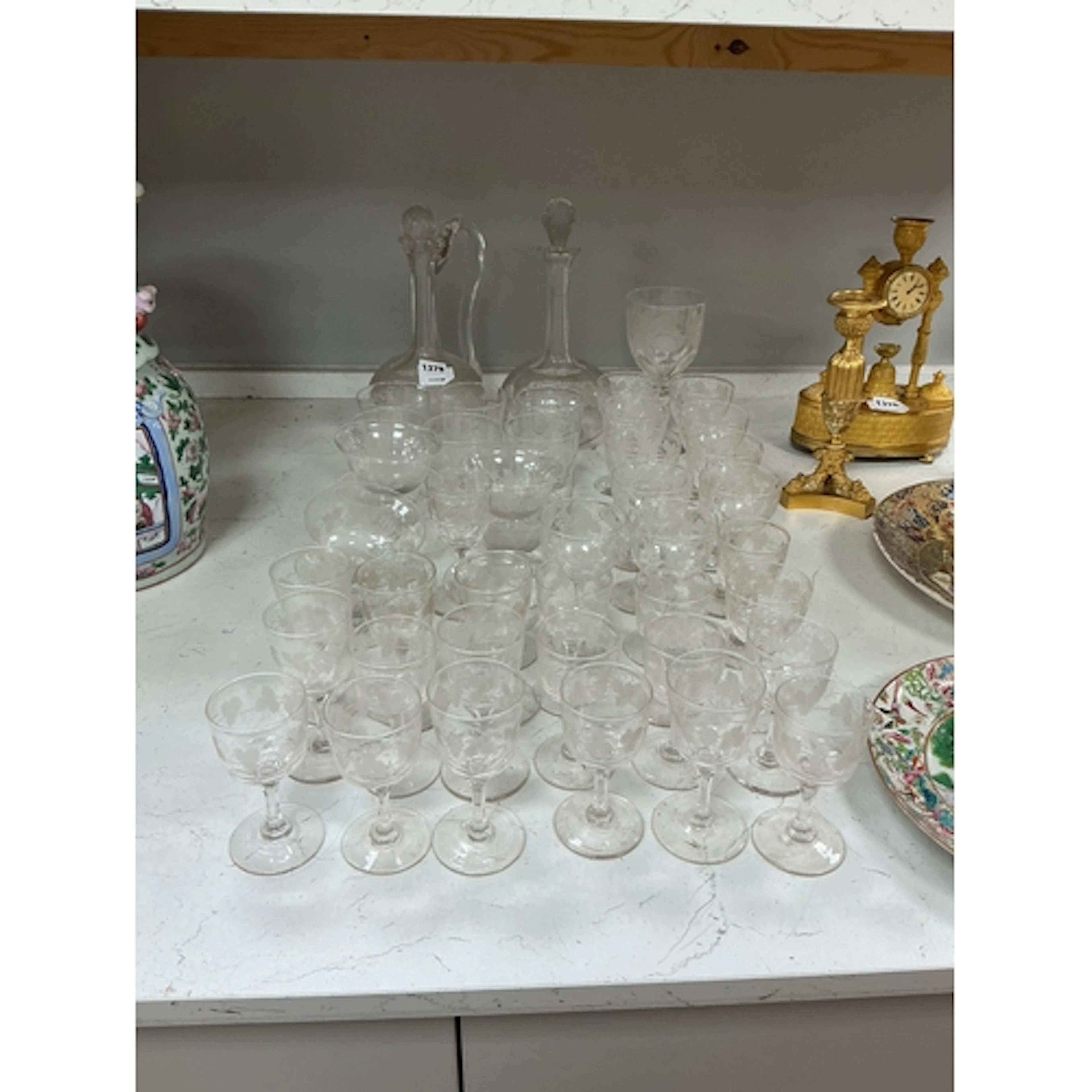 A part suite of Victorian vine engraved glasses to include t...