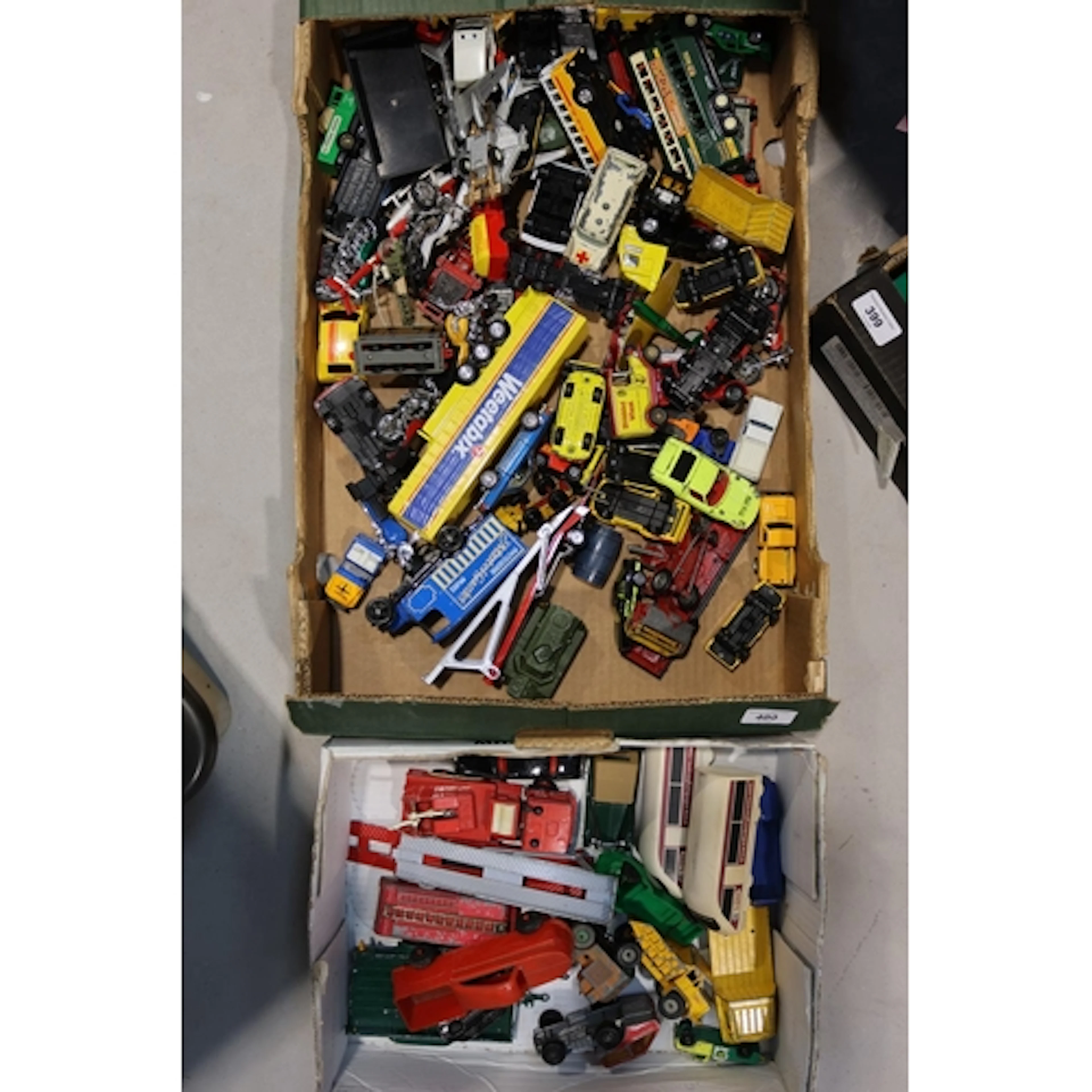 Two boxes of diecast model vehicles to include Dinky Toys Fi...