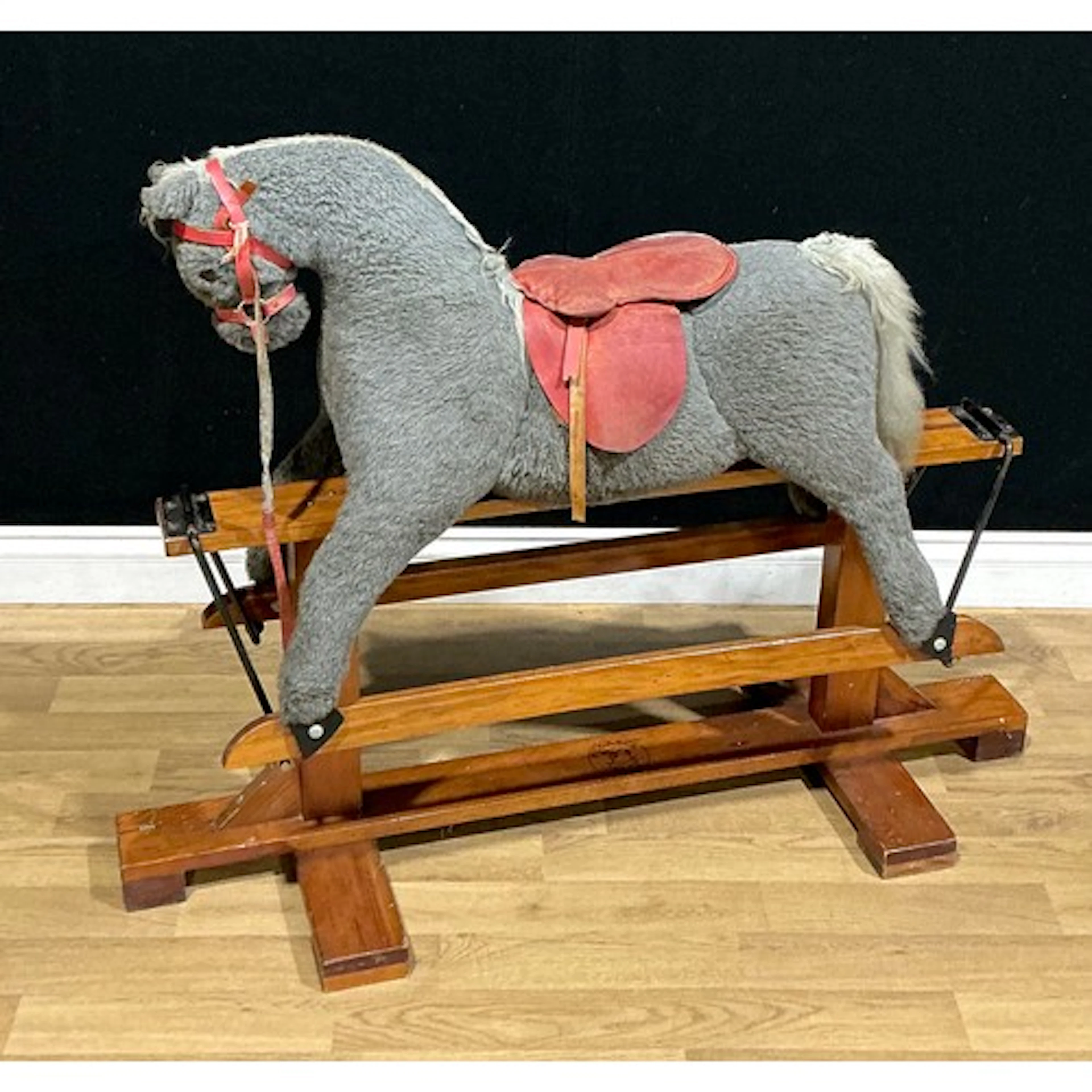 A 1970s rocking horse, by Pegasus Toys, 88cm high, 113cm lon...