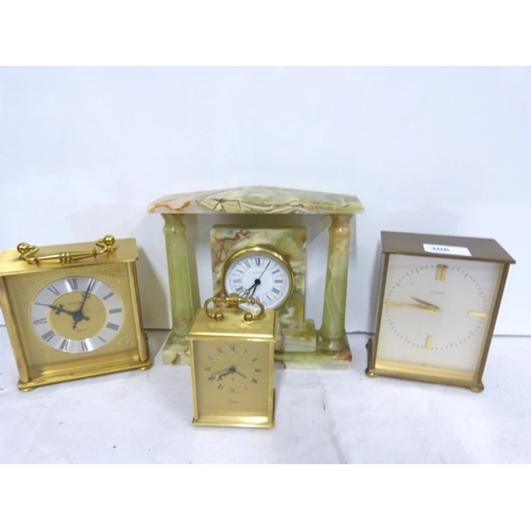 Garrard brass clock, a brass carriage clock and two others. ...