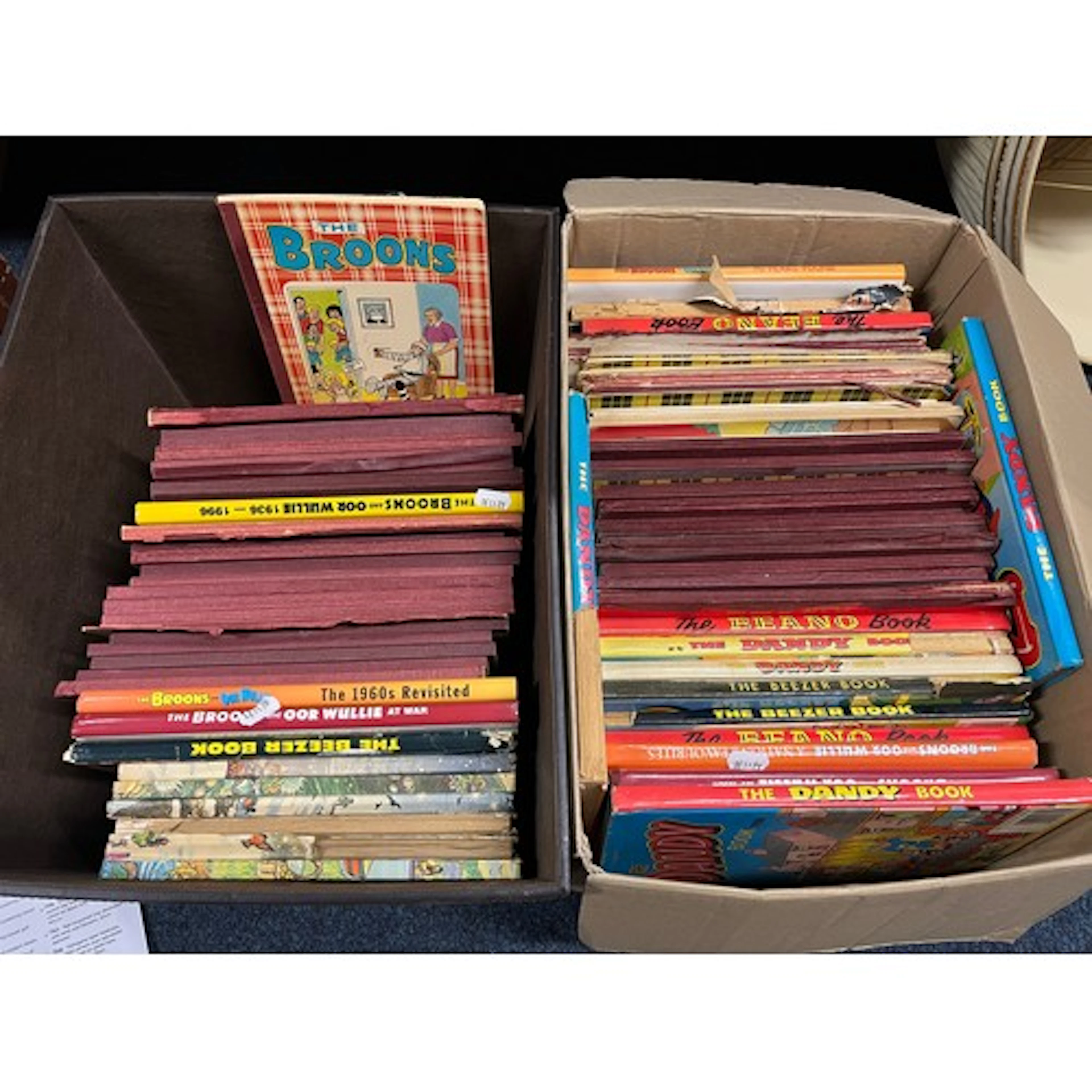 Two boxes containing children's annuals to include The Beano...