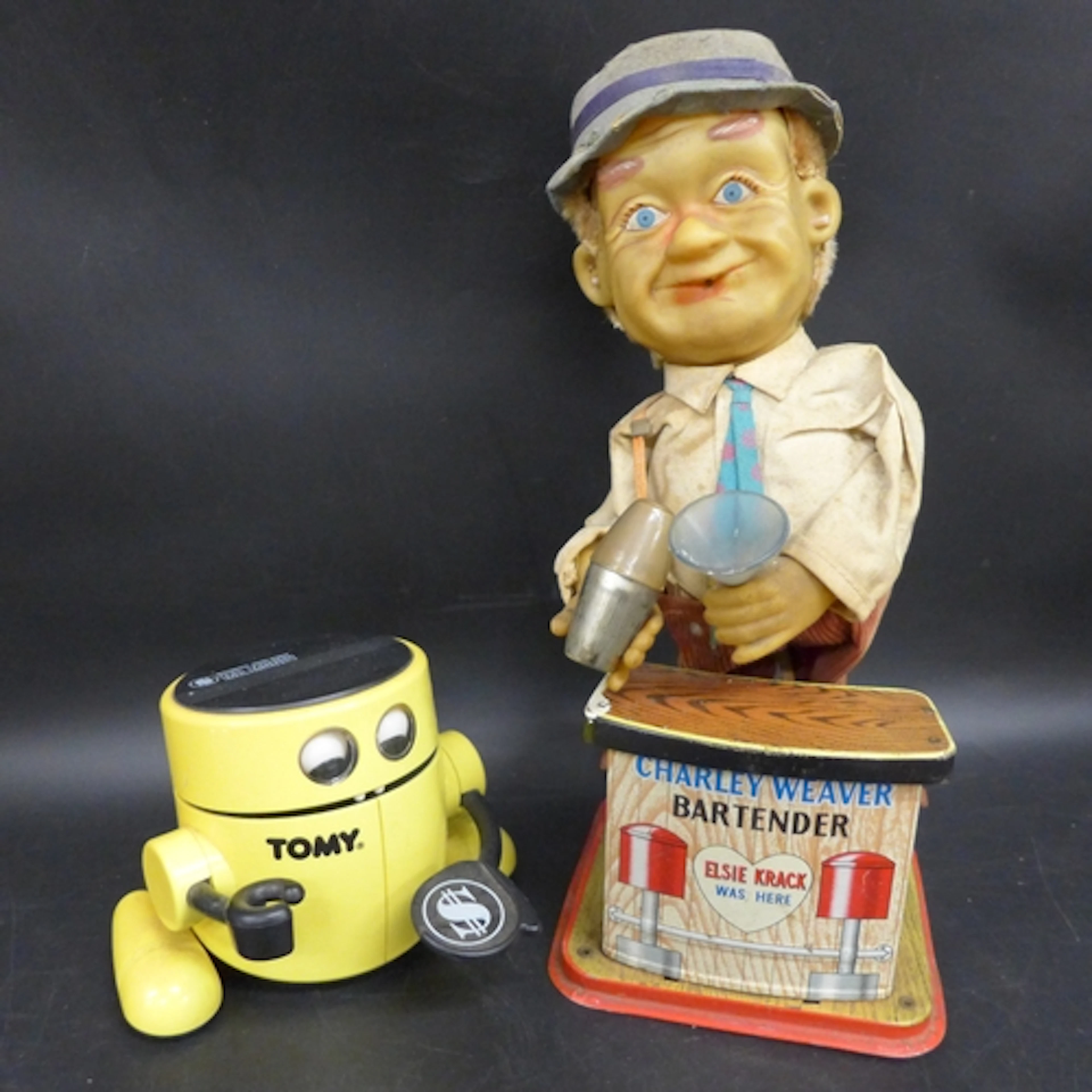 Two vintage toys, a Tomy automatic bank robot and a Charlie ...