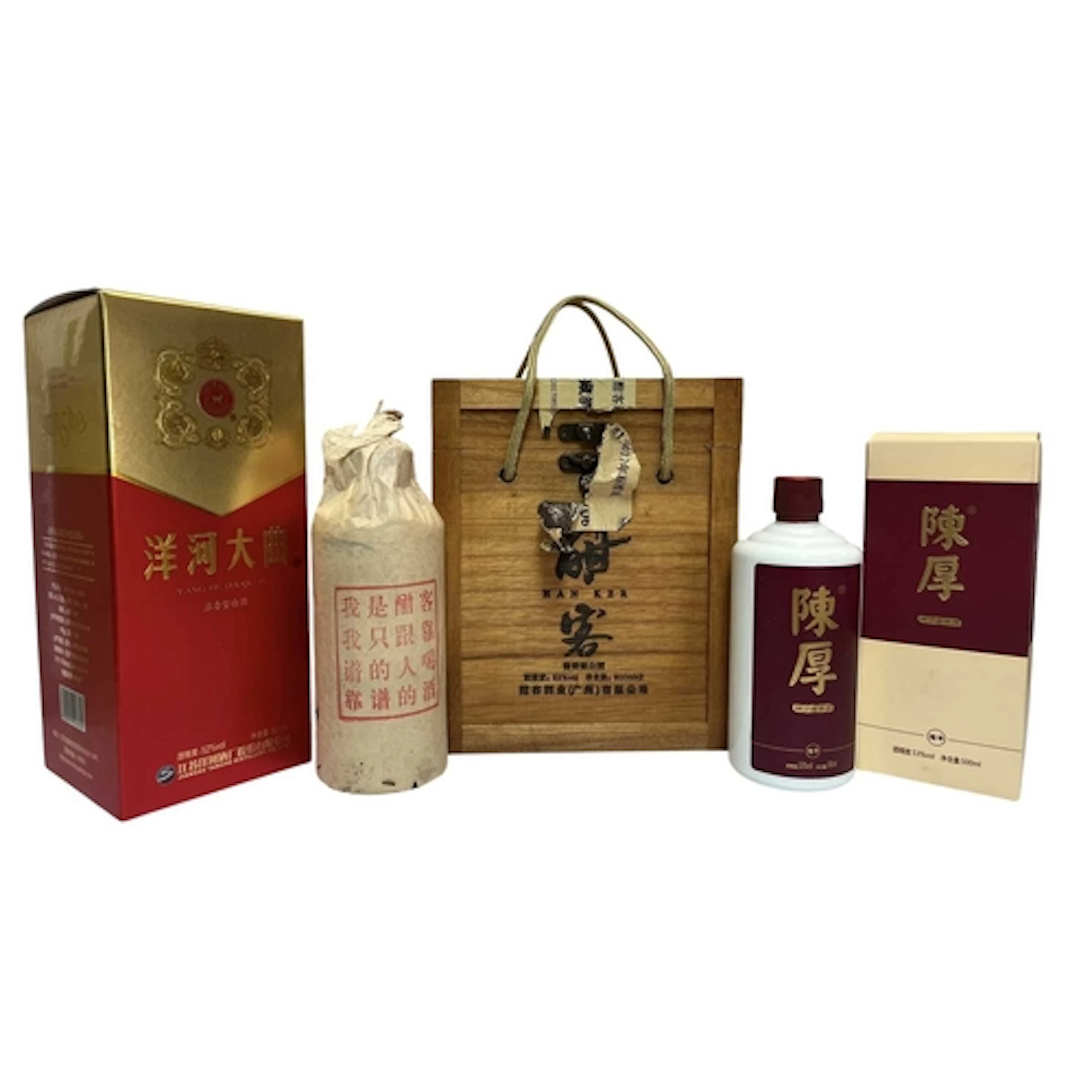 Three bottles of Chinese spirits housed within their origina...