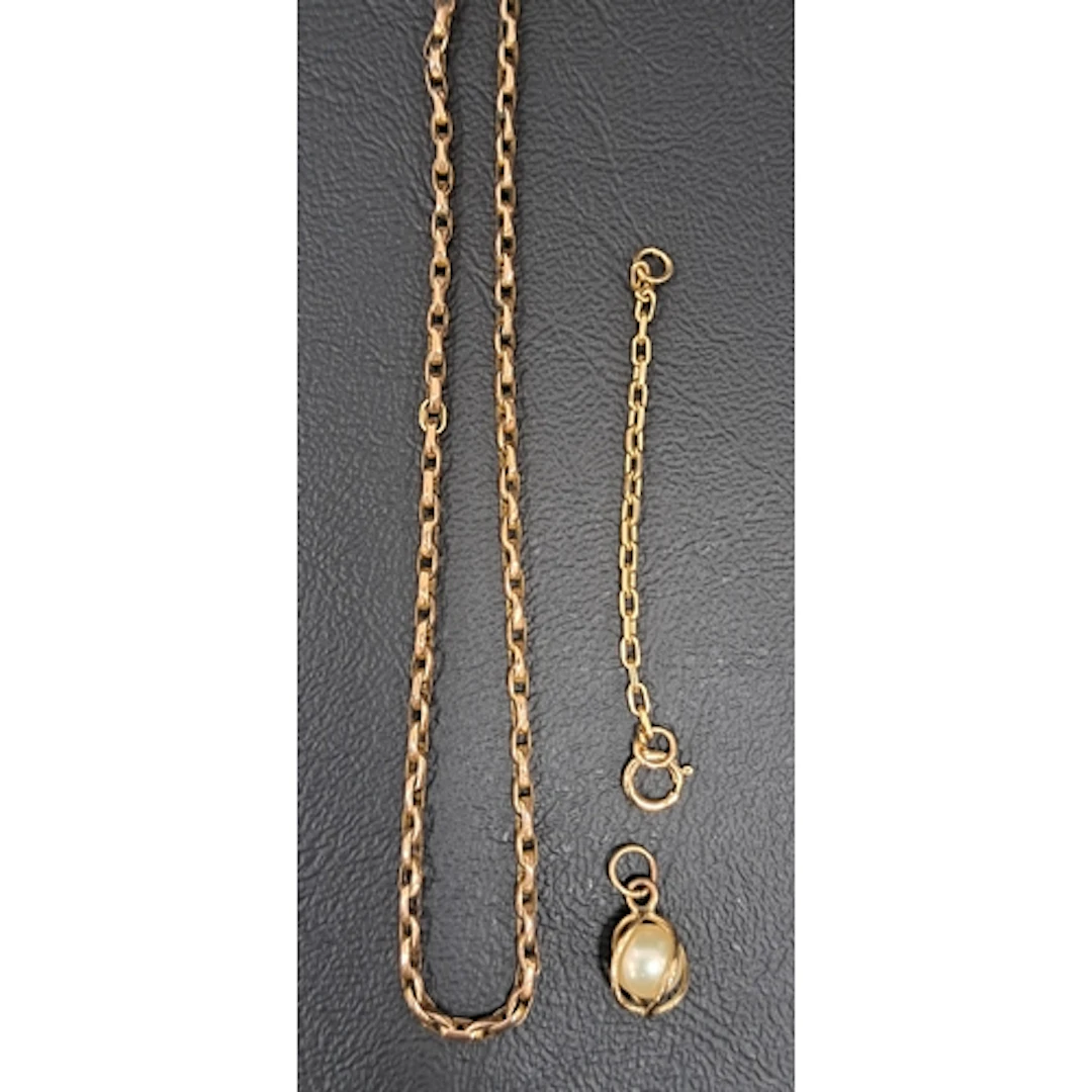 NINE CARAT GOLD NECK CHAIN 42.5cm long, with safety chain, a...