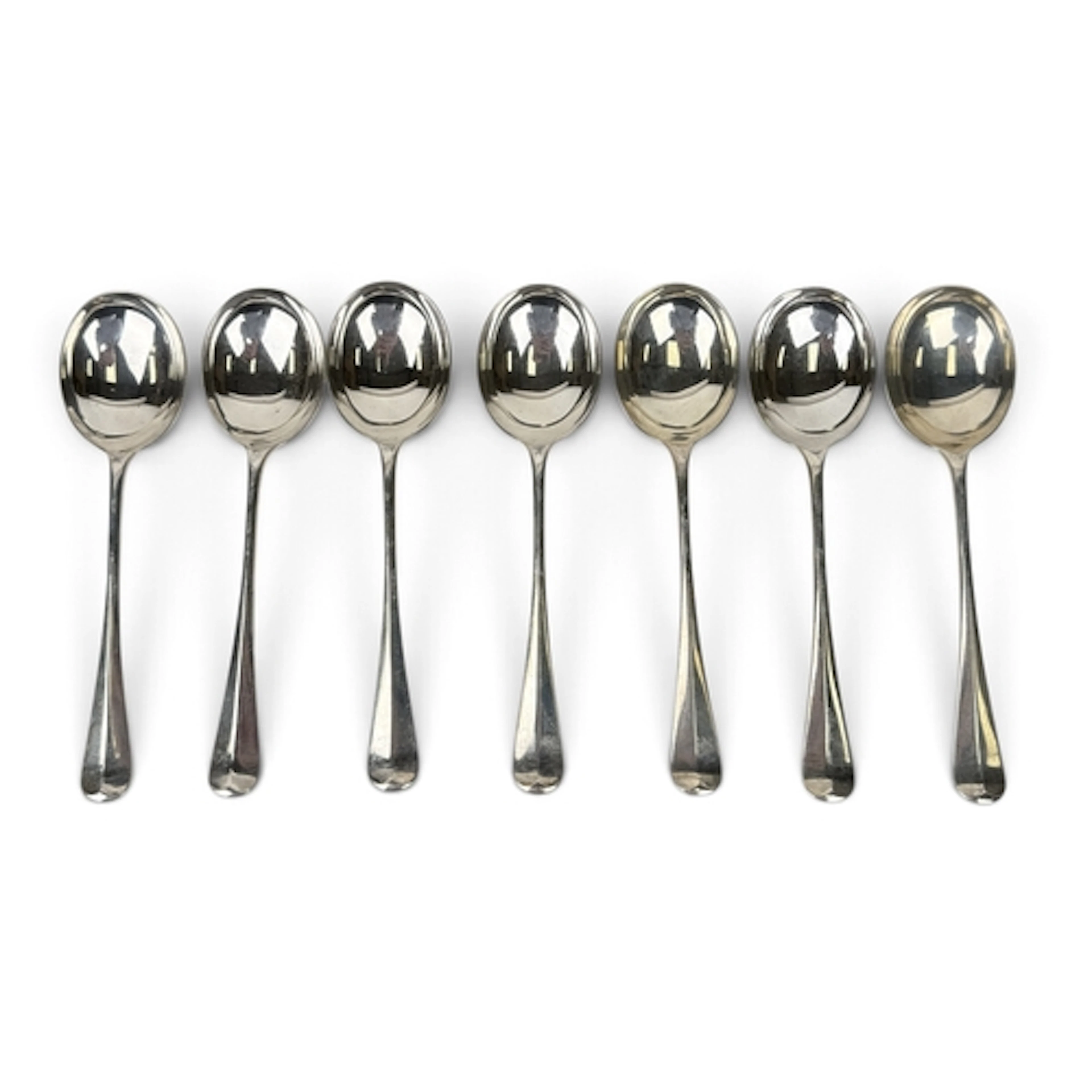 A SET OF SEVEN SILVER HANOVERIAN RAT TAIL PATTERN SOUP SPOON...