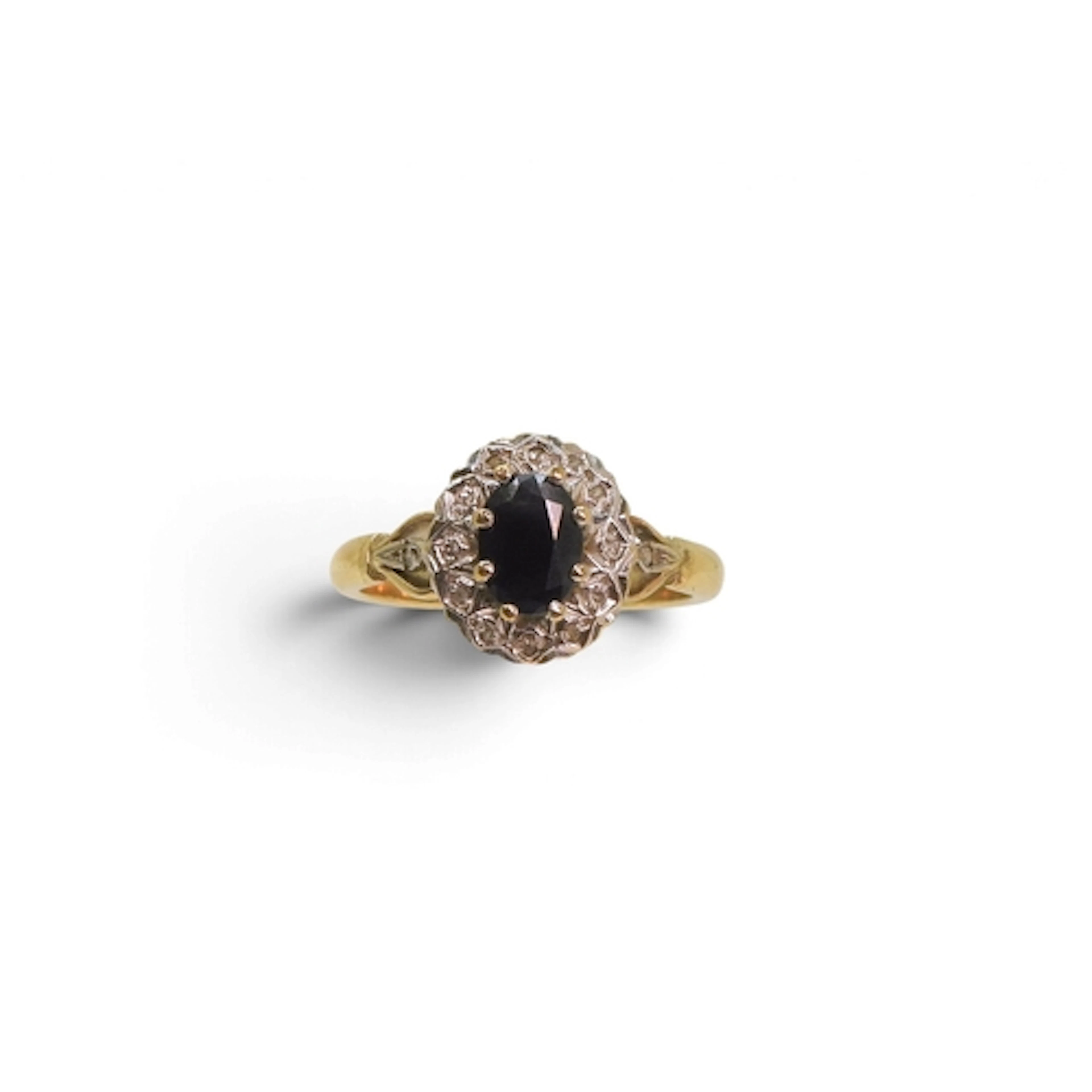 A 9ct gold sapphire and diamond accent cluster ring, size V1...