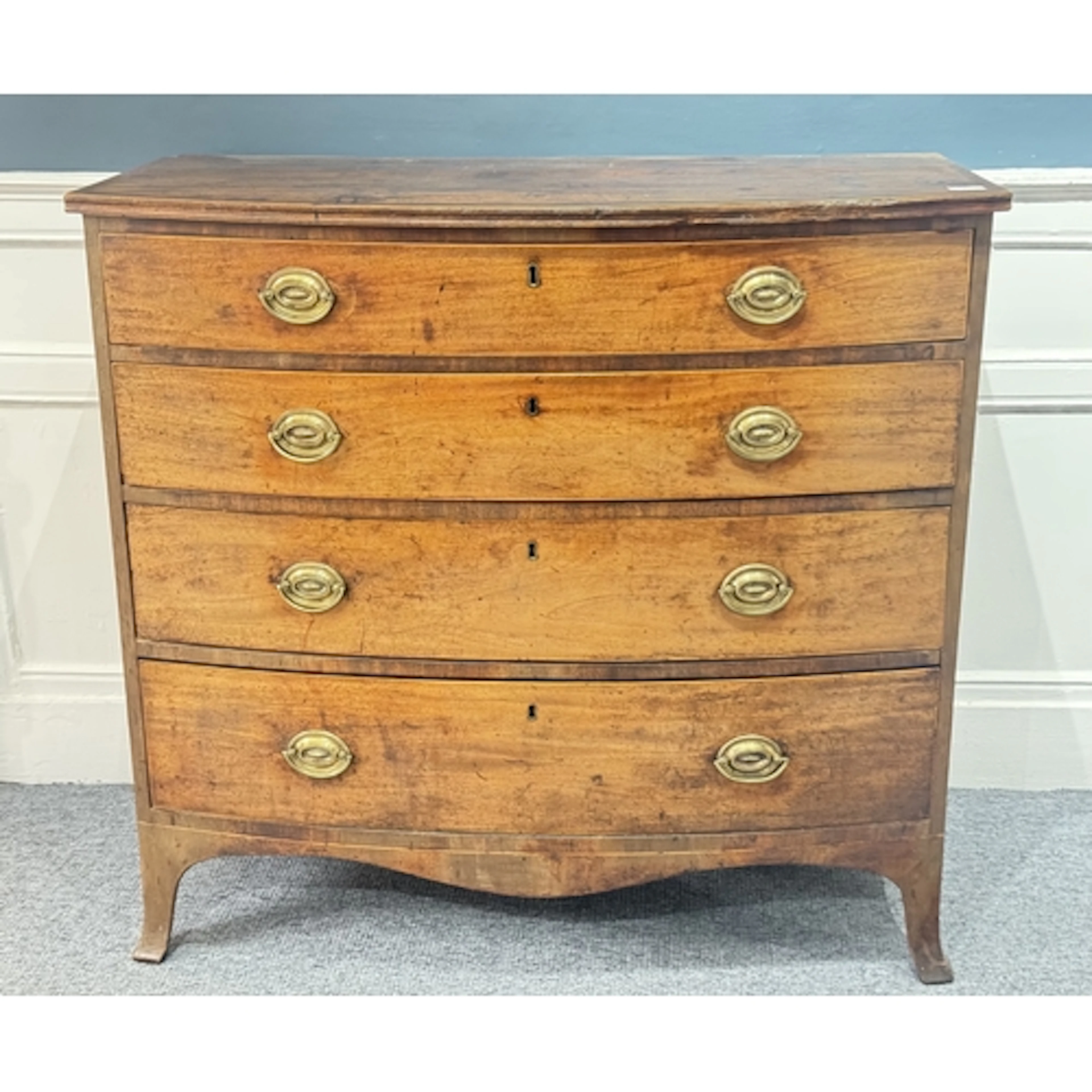 Furniture: a 19th century mahogany bow fronted chest of draw...