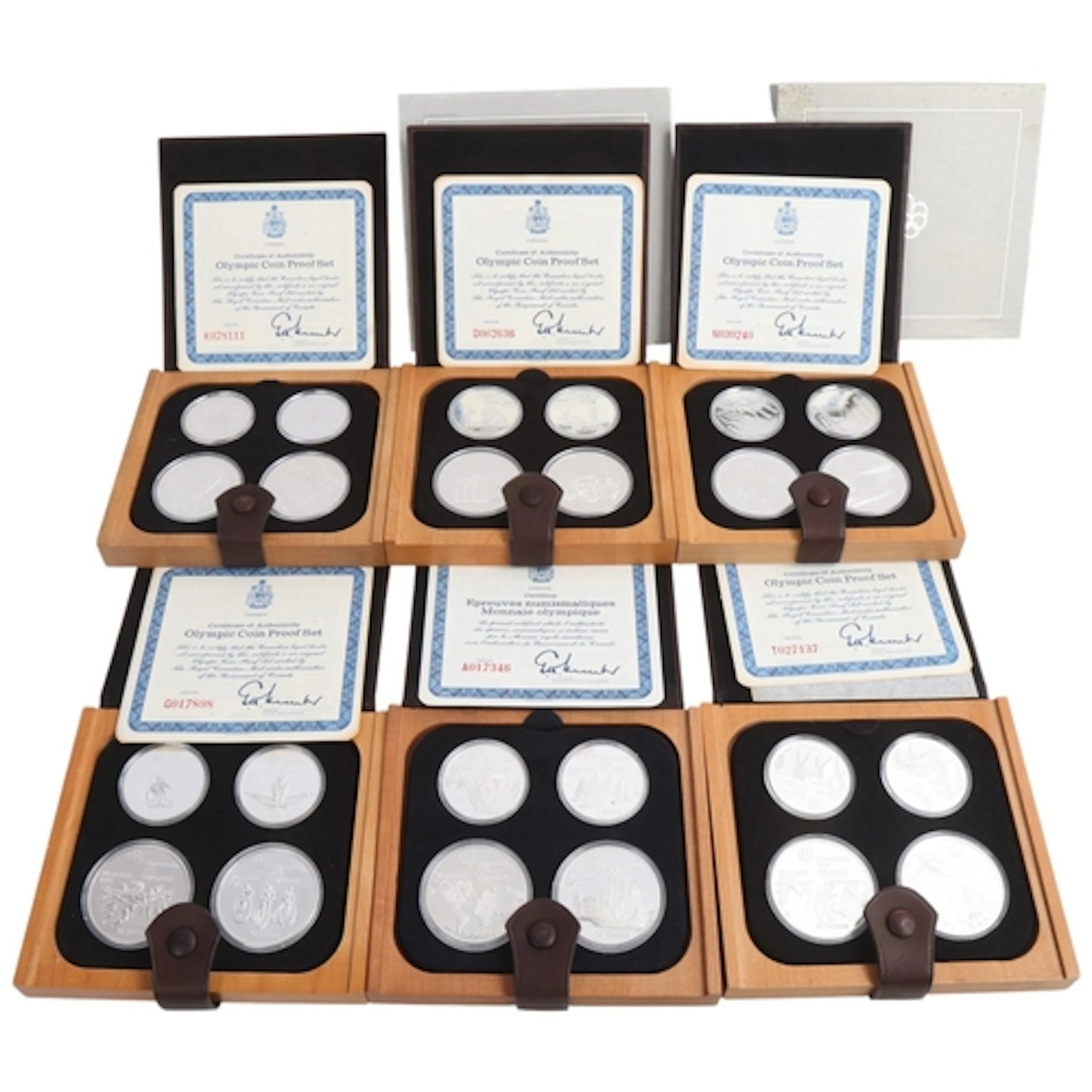 Six 1976 Montreal Olympic silver proof coin sets, issued by ...