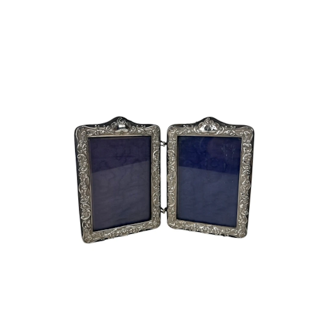 A SILVER MOUNTED FOLD-OUT PICTURE FRAME, BY SPURRIER & C...