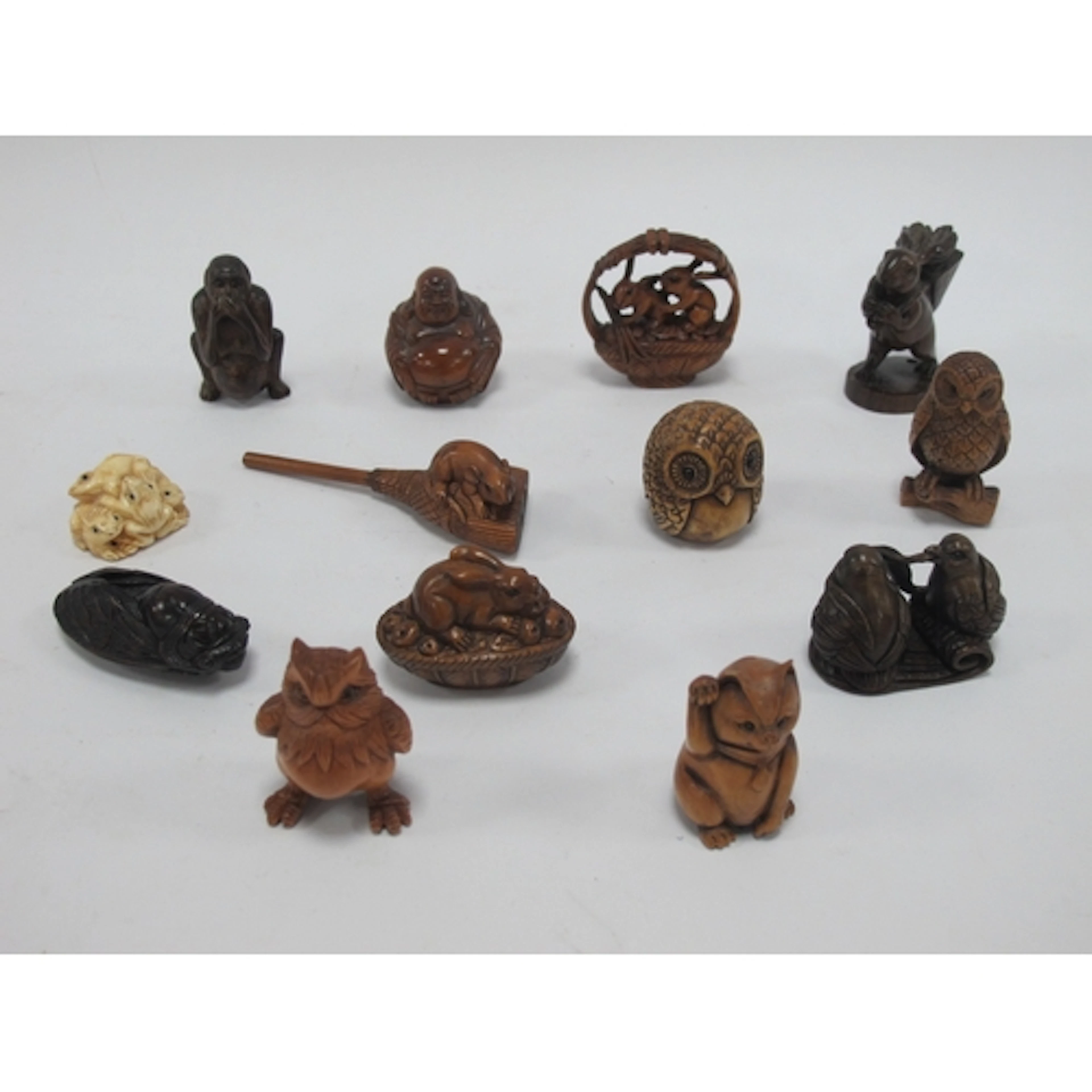 Late XX Century Netsukes including Buddha, monkey, owls, rab...