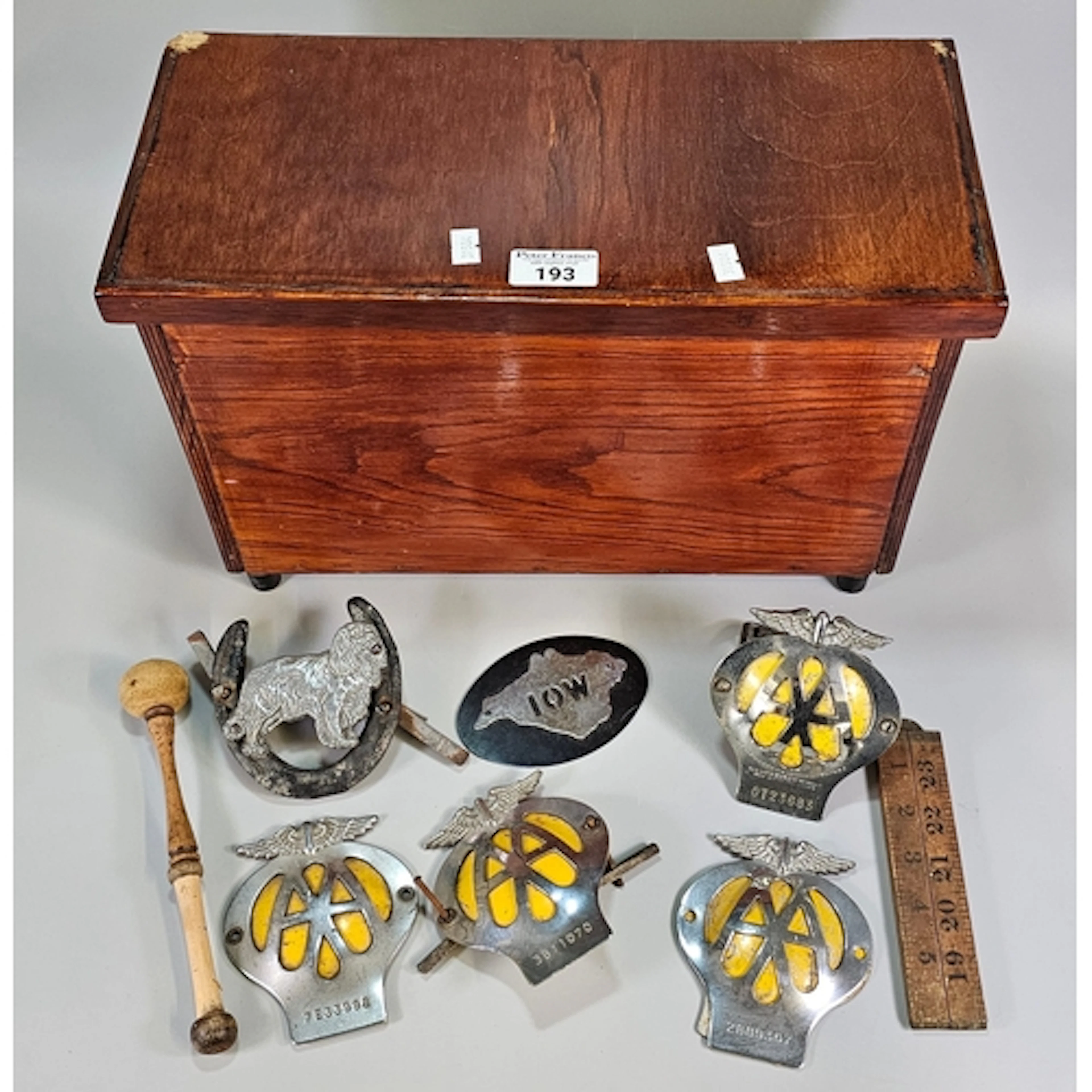 Wooden box comprising a collection of AA chrome badges and o...