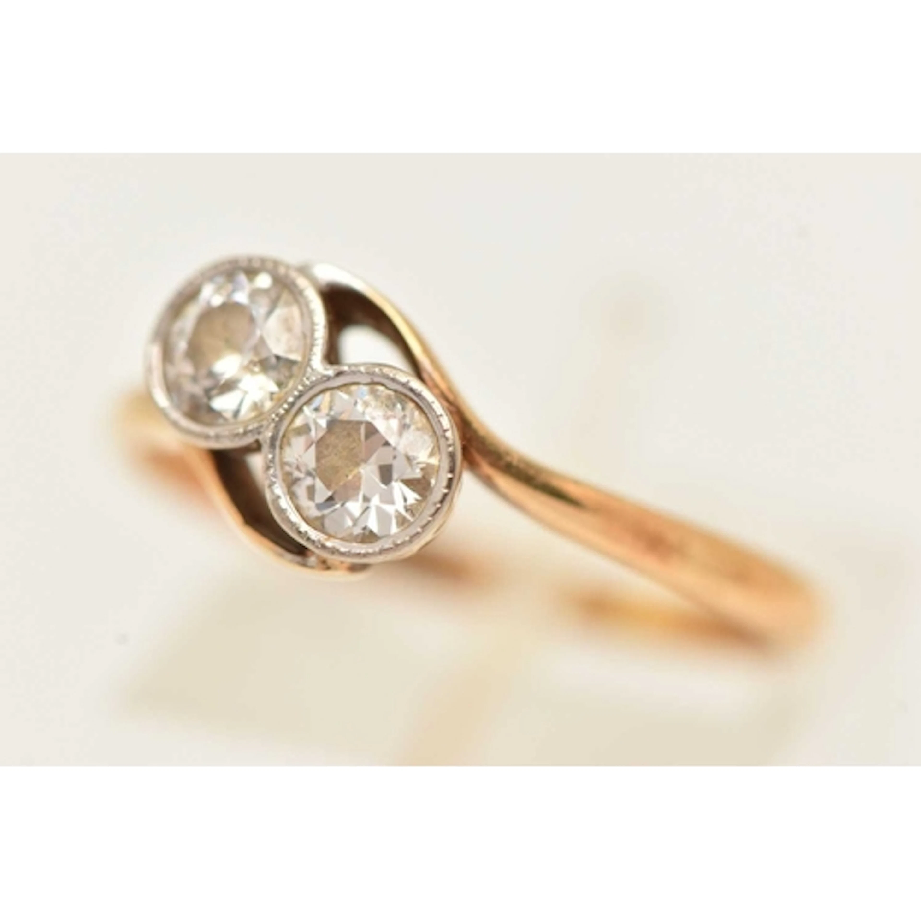 A TWO STONE TOI ET MOI DIAMOND RING, two old cut diamond rin...