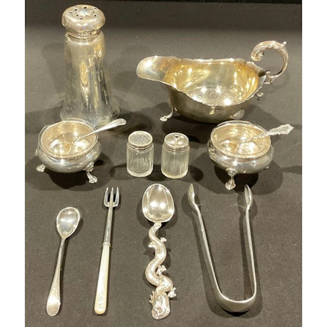 A George V silver sauce boat, 14cm long, Birmingham 1928; a ...