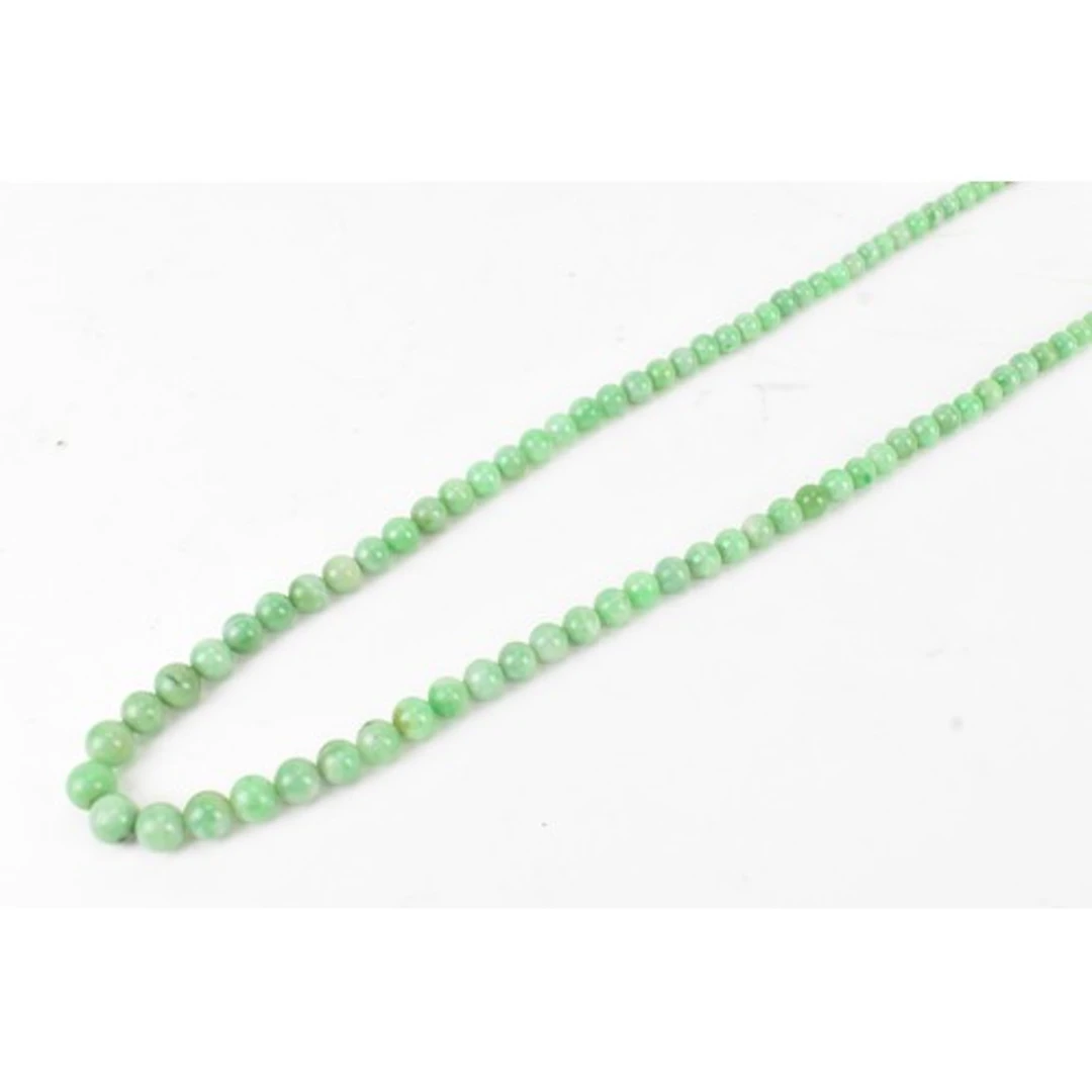 A Chinese jade beaded necklace, consisting of approximately ...