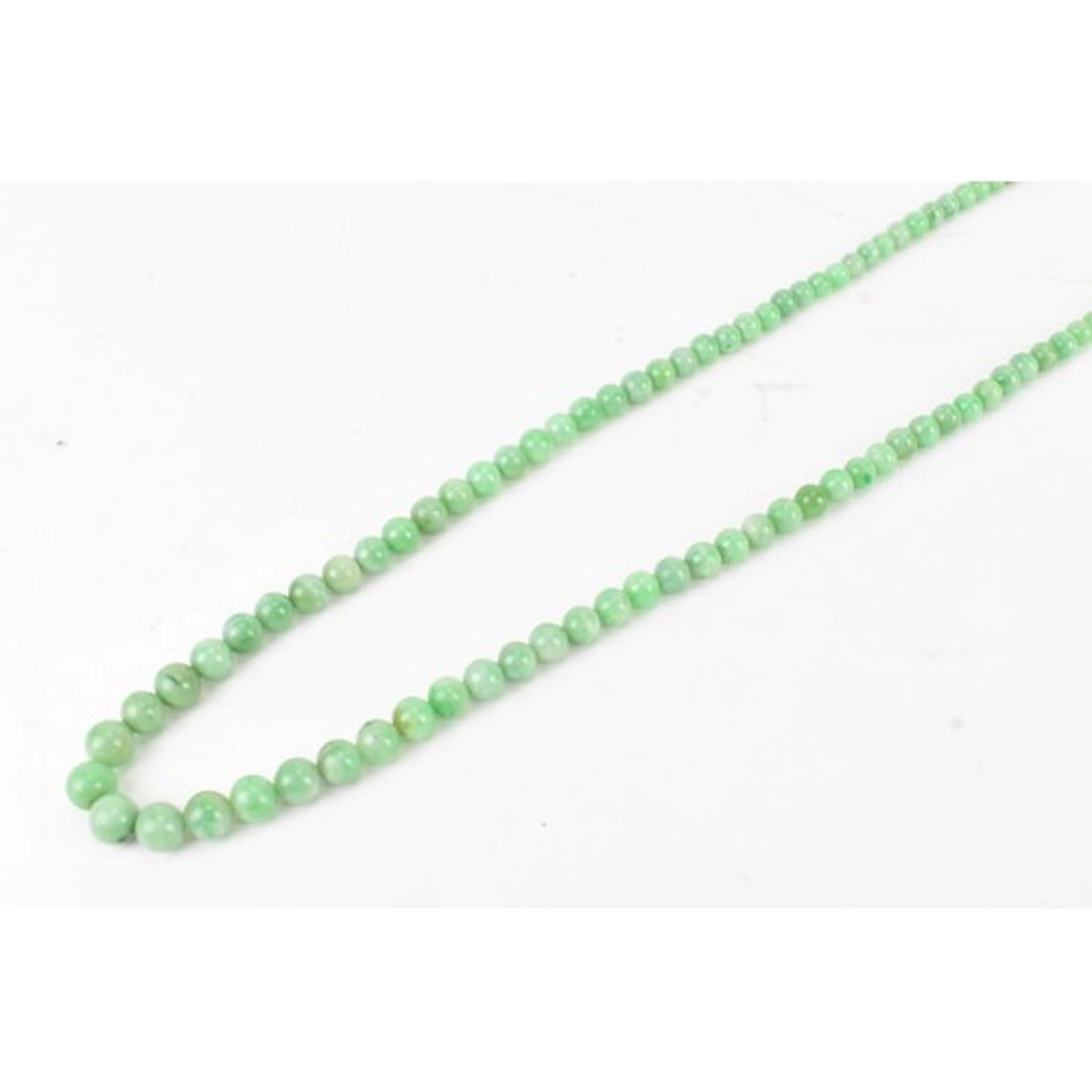 A Chinese jade beaded necklace, consisting of approximately ...