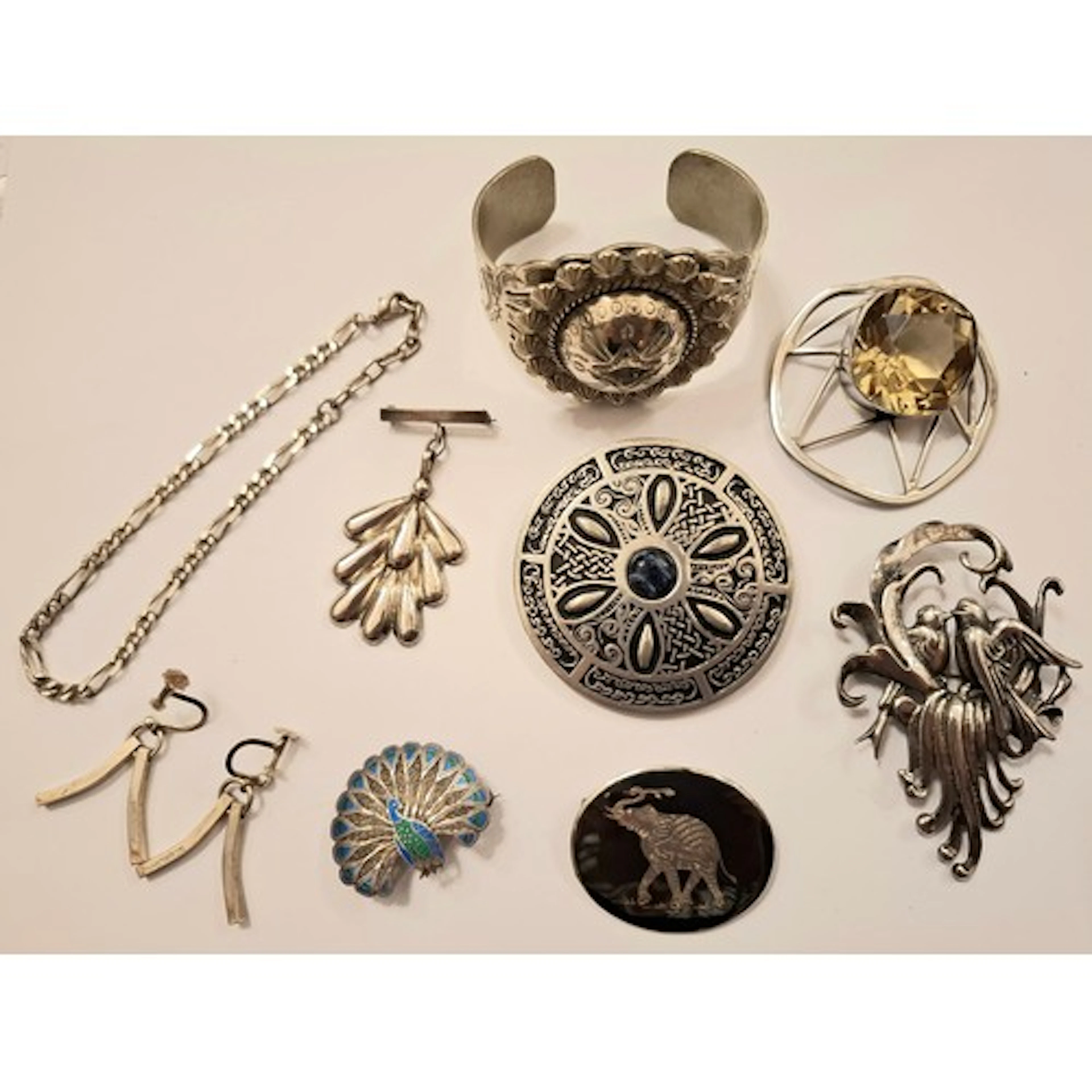 A quantity of silver, pewter and white metal jewellery to in...