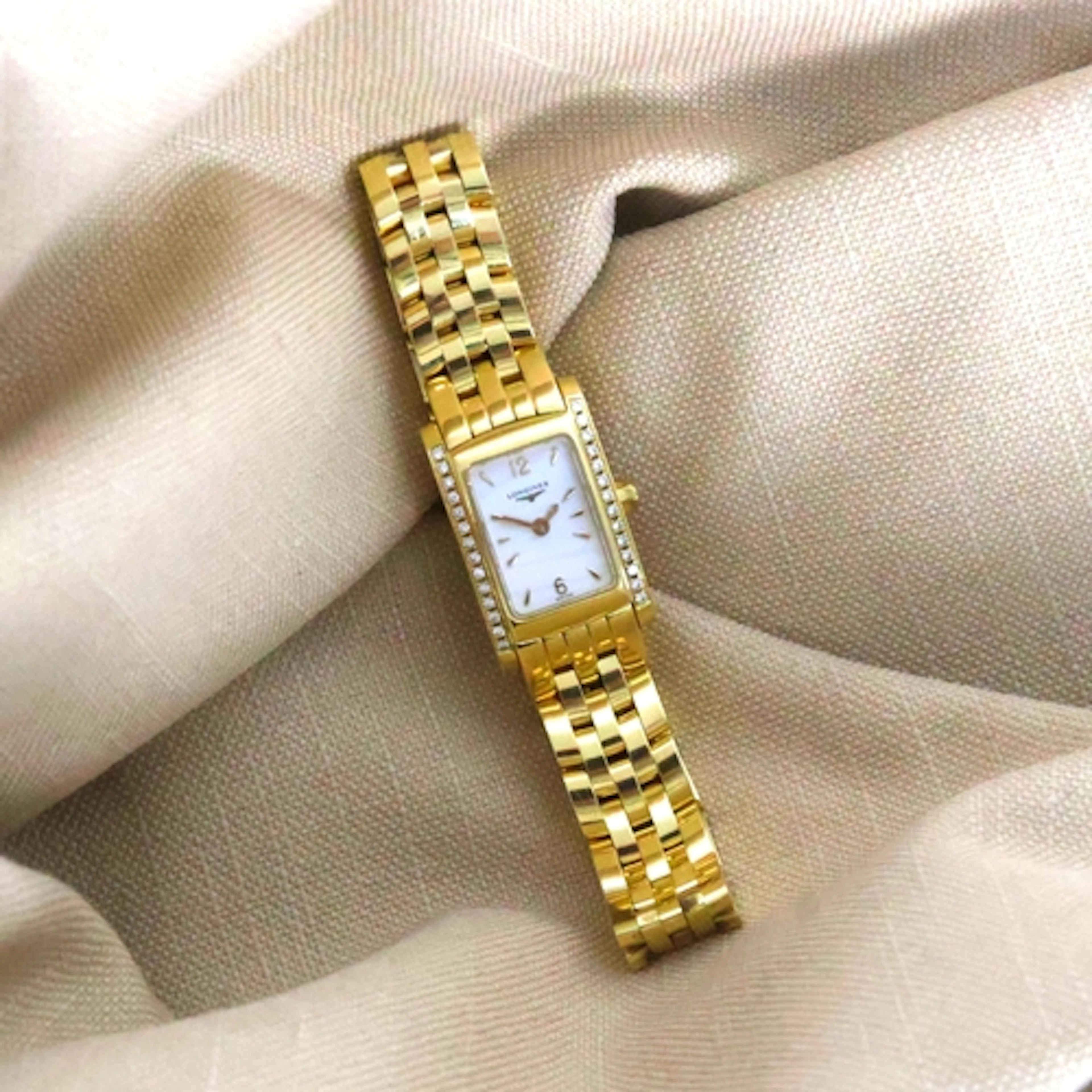 A contemporary ladies Dolce Vita 18ct and diamond Longines w...