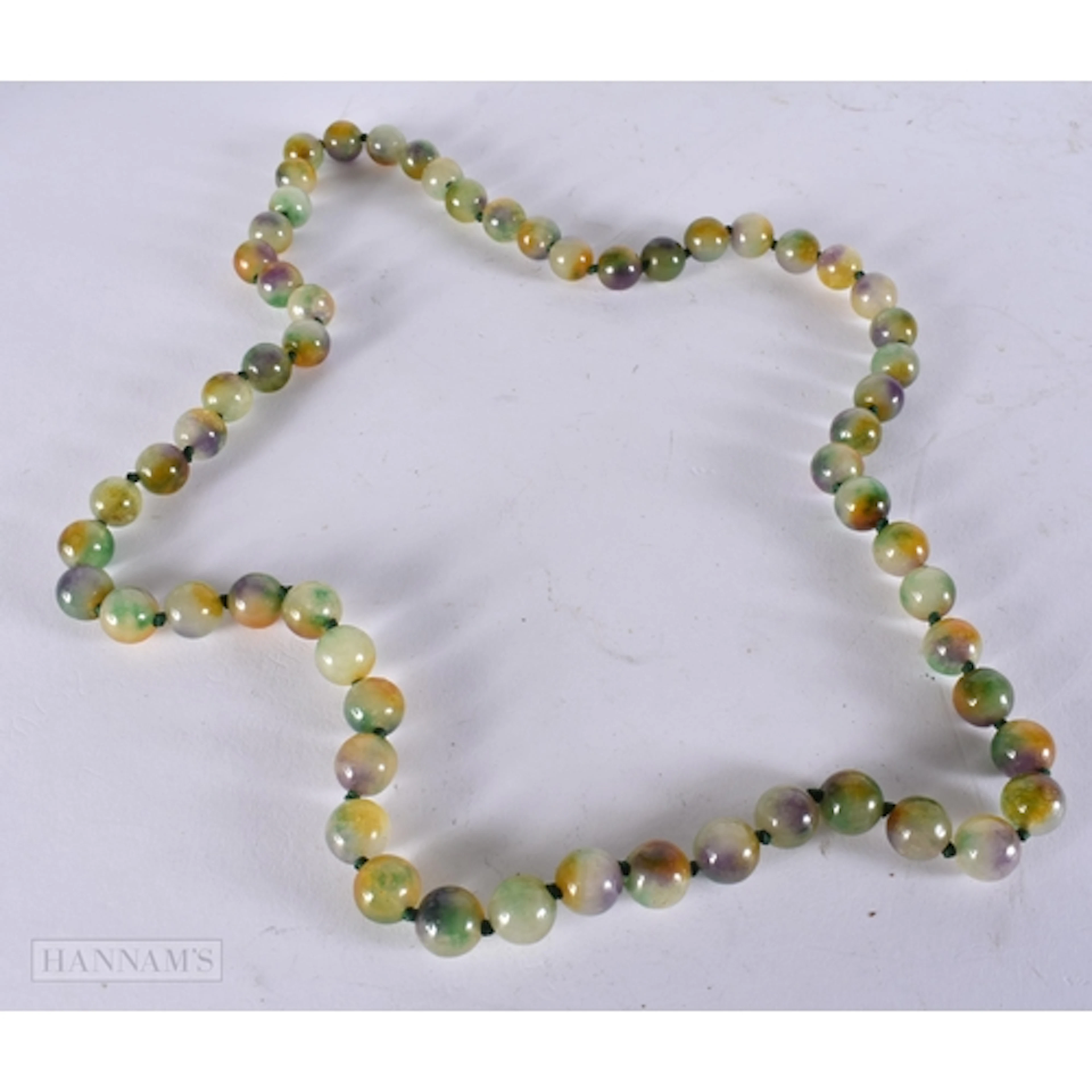 A MULTI COLOURED JADE STRING BEAD NECKLACE. 84 cm