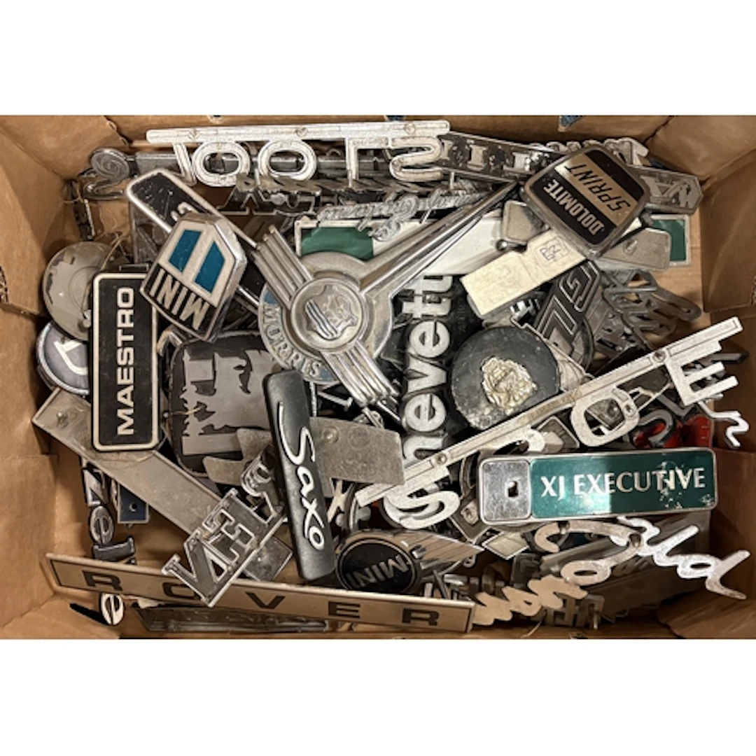 A collection of vintage motorcar badges. Est. £20 - £30.