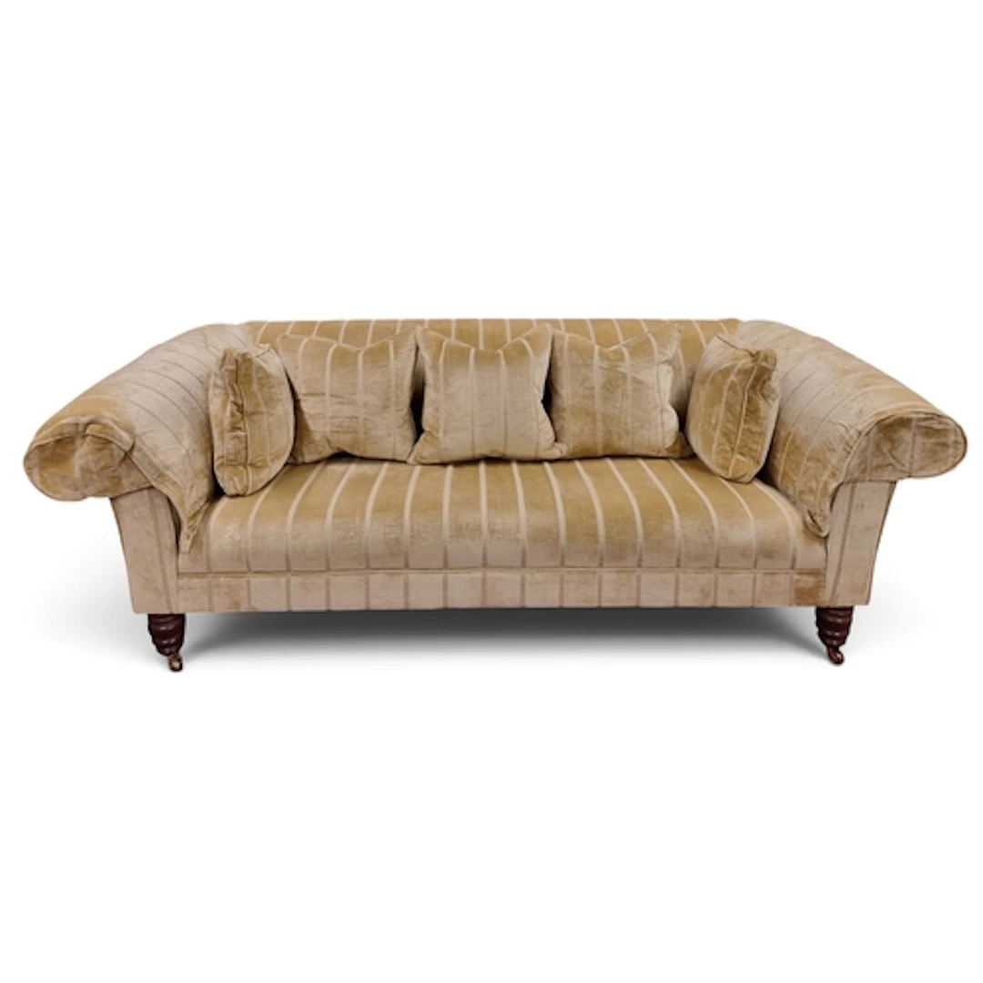 A large roll arm Churchill three seater Couch upholstered in...