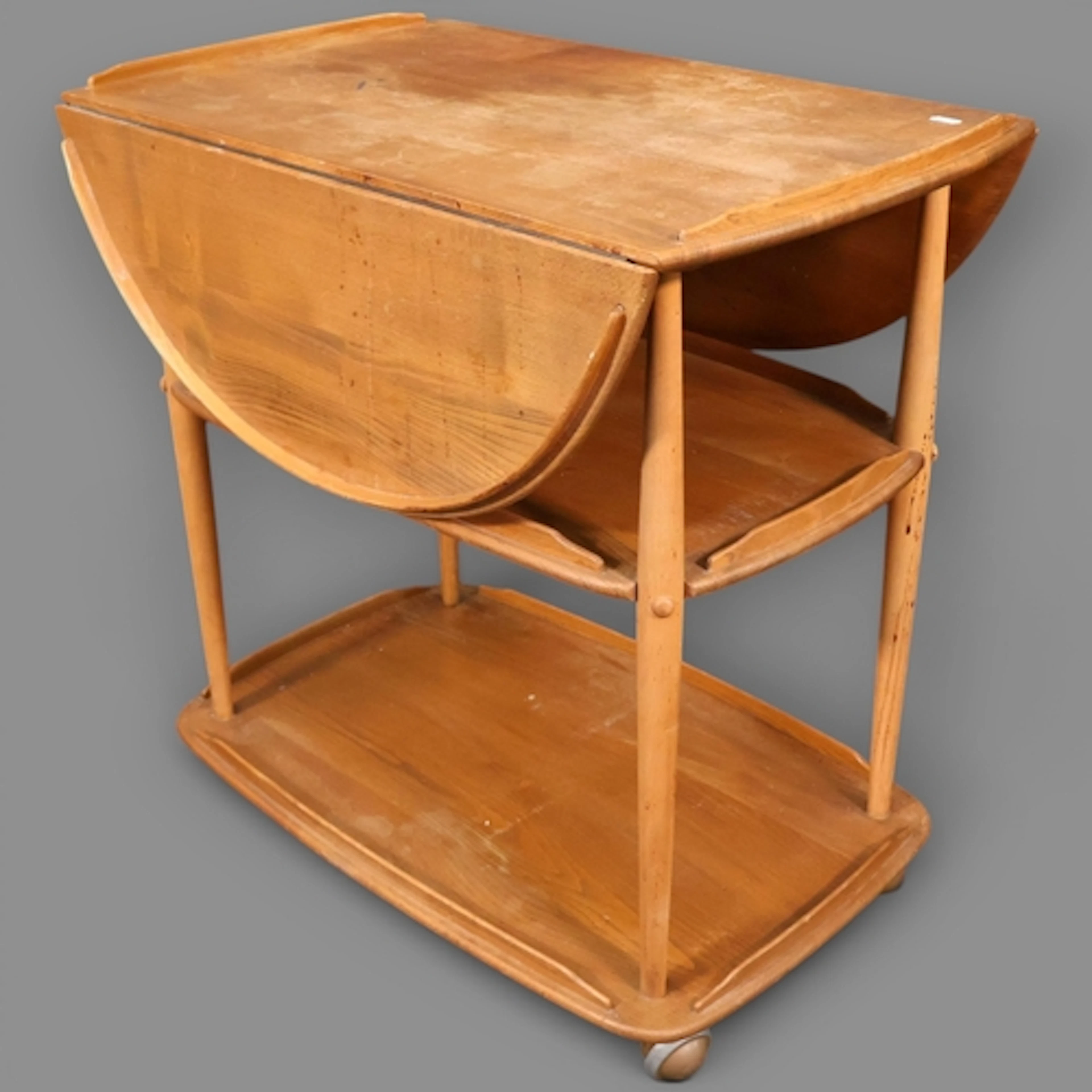 A Mid-Century extending Ercol model 505 Drinks trolley in so...