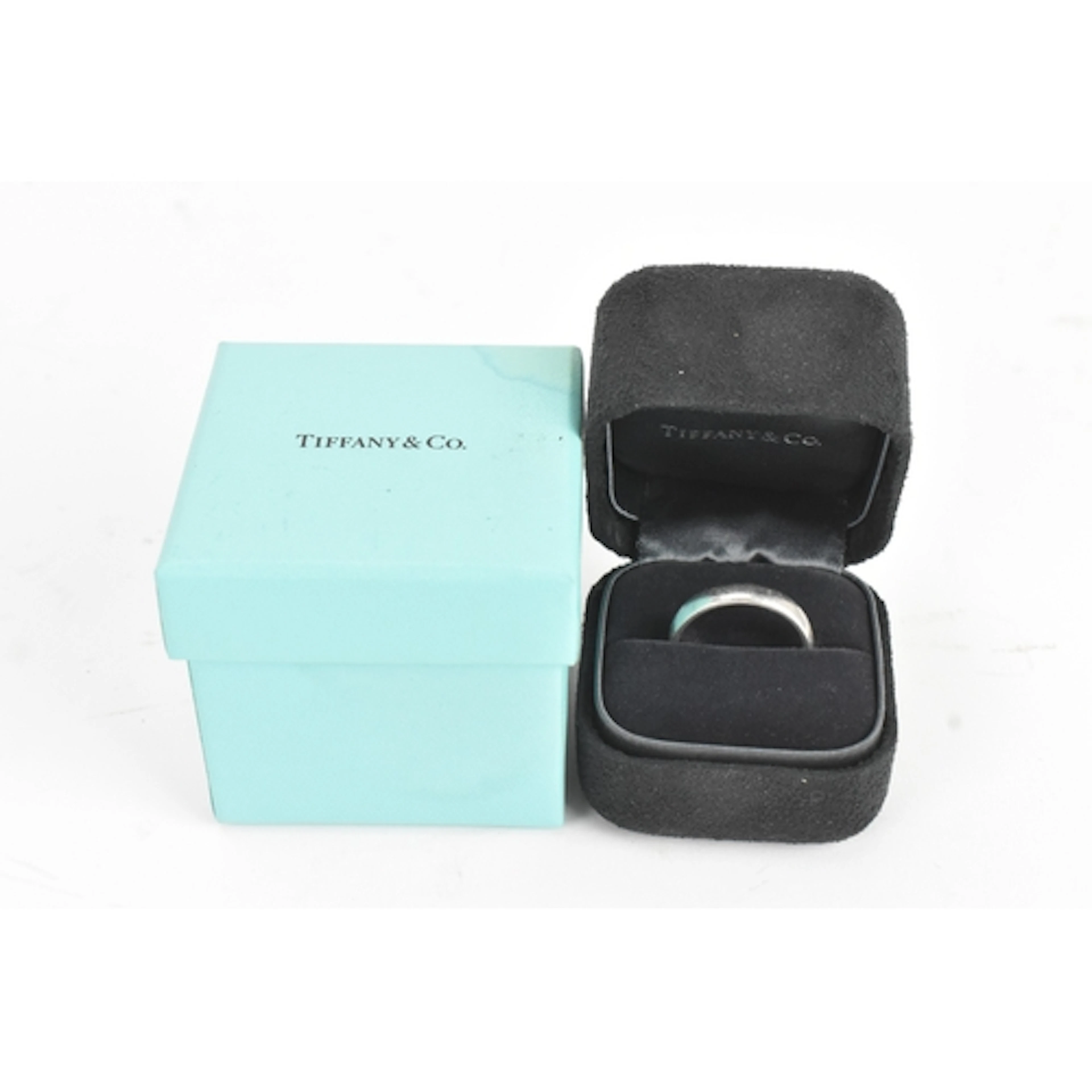 A Tiffany platinum wedding band, with outer presentation box...