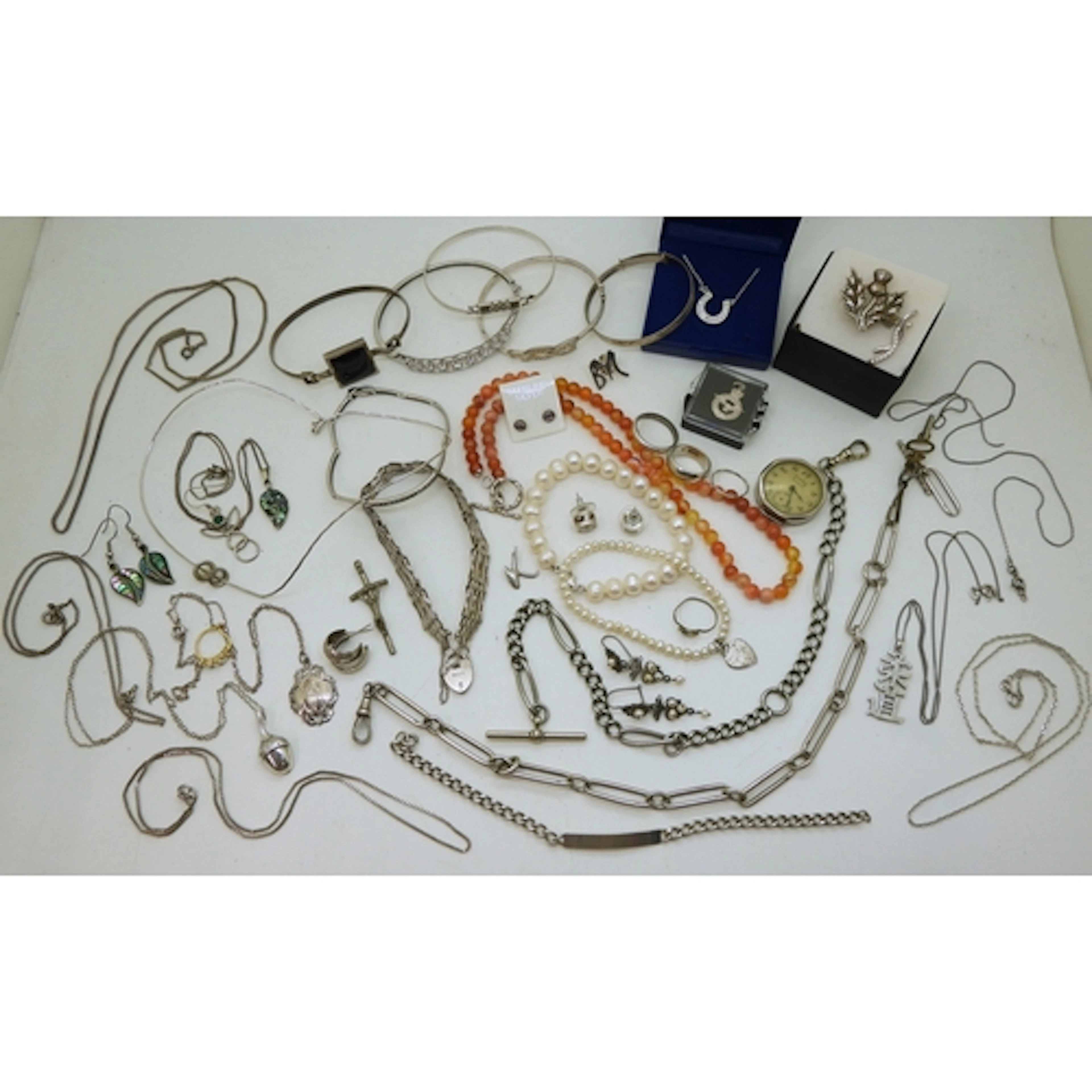 A collection of silver and white metal jewellery to include ...