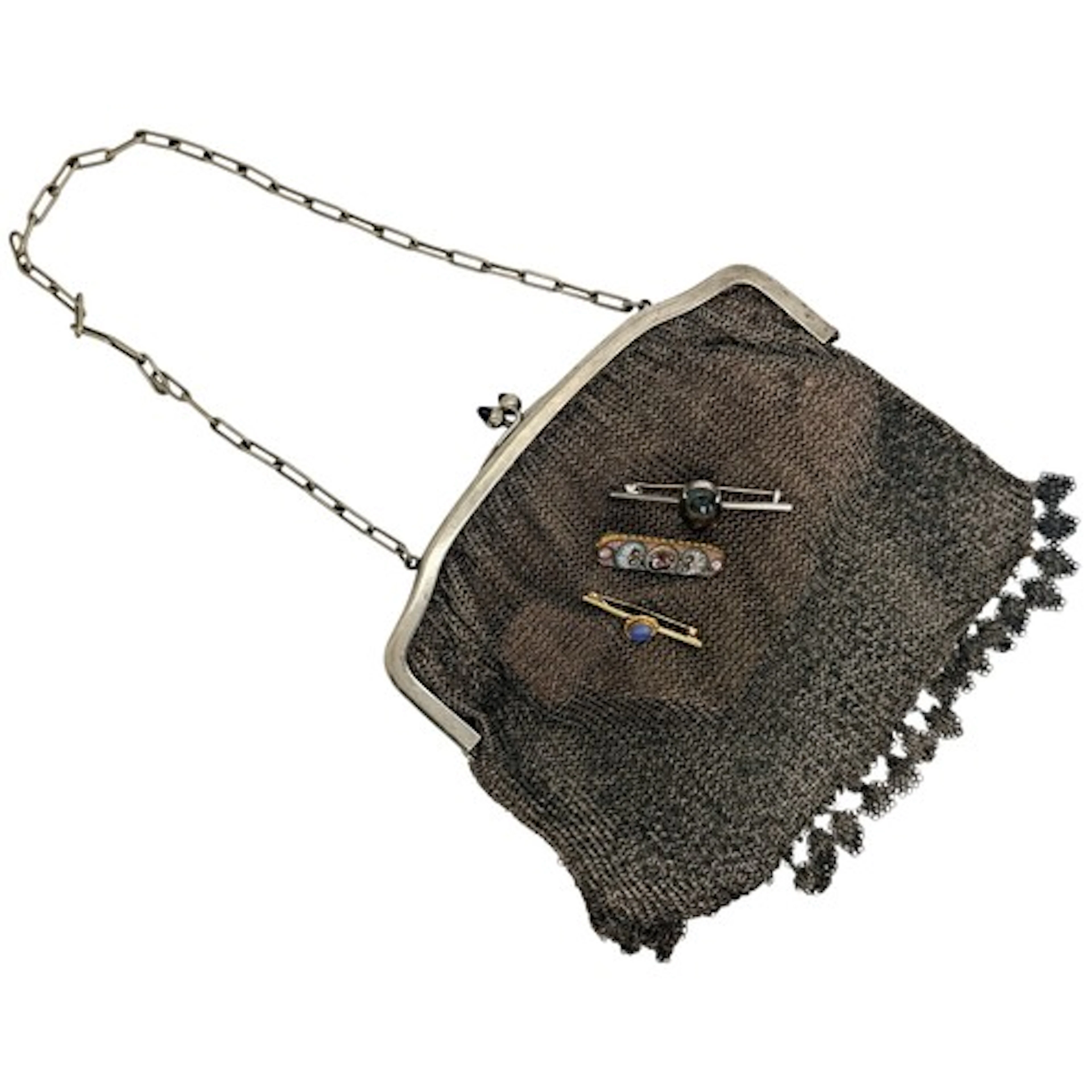 A white metal chain mail purse, with blue cabochon inset cla...