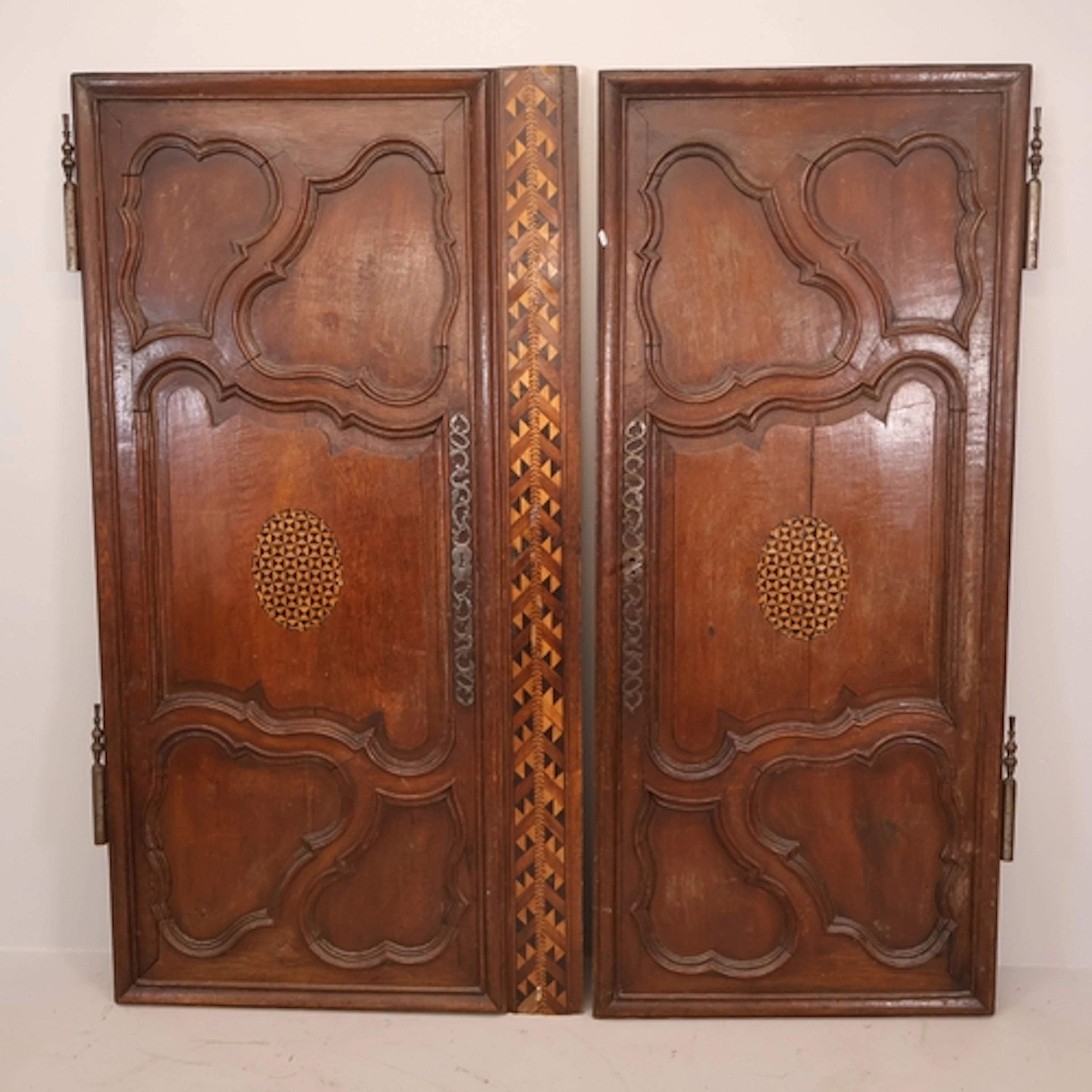Two antique French oak armoire doors, with inlaid specimen w...