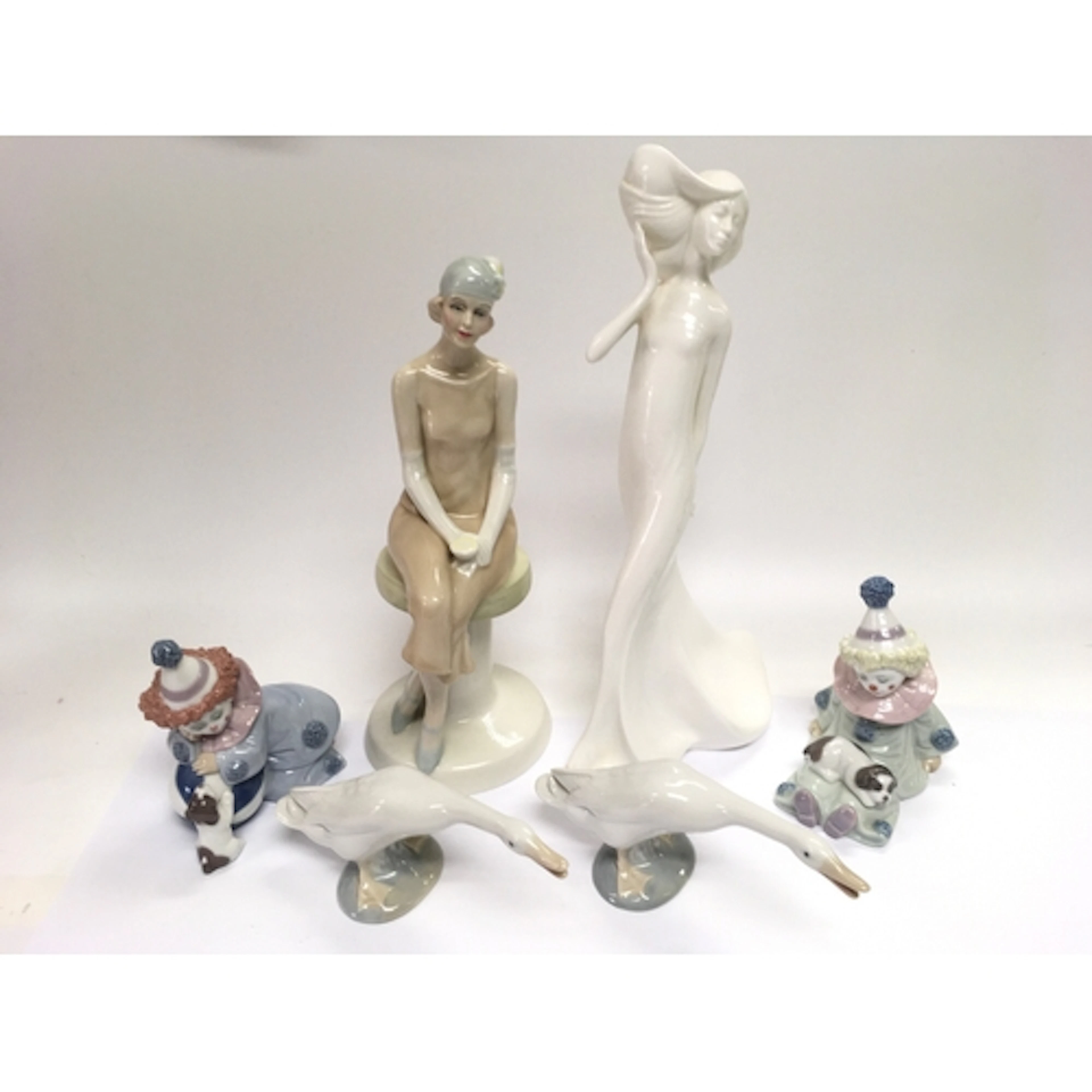 Six Lladro and Royal Doulton figures comprising Cocktails HN...