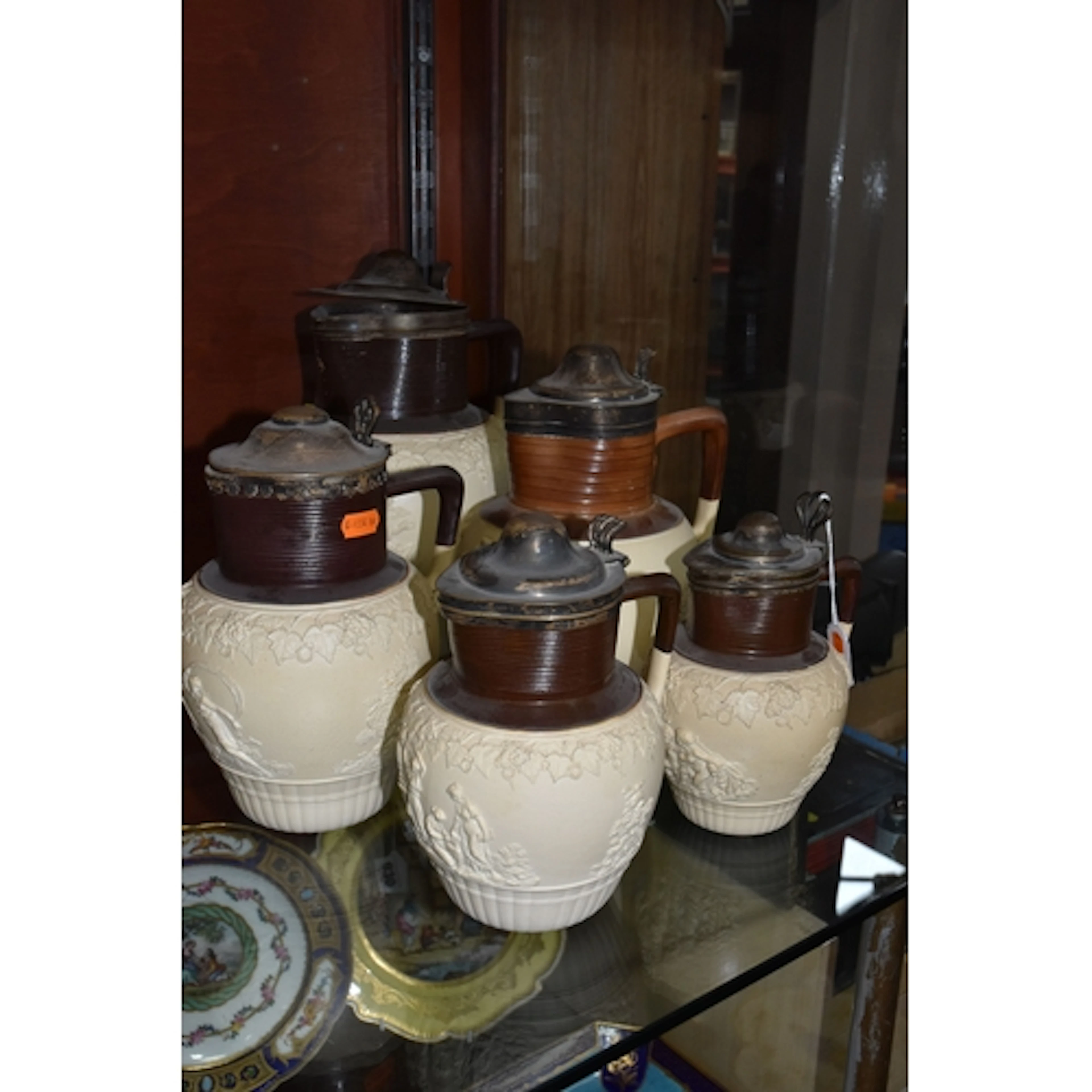 FIVE EARLY 19TH CENTURY TURNER STONEWARE JUGS, THREE WITH HA...
