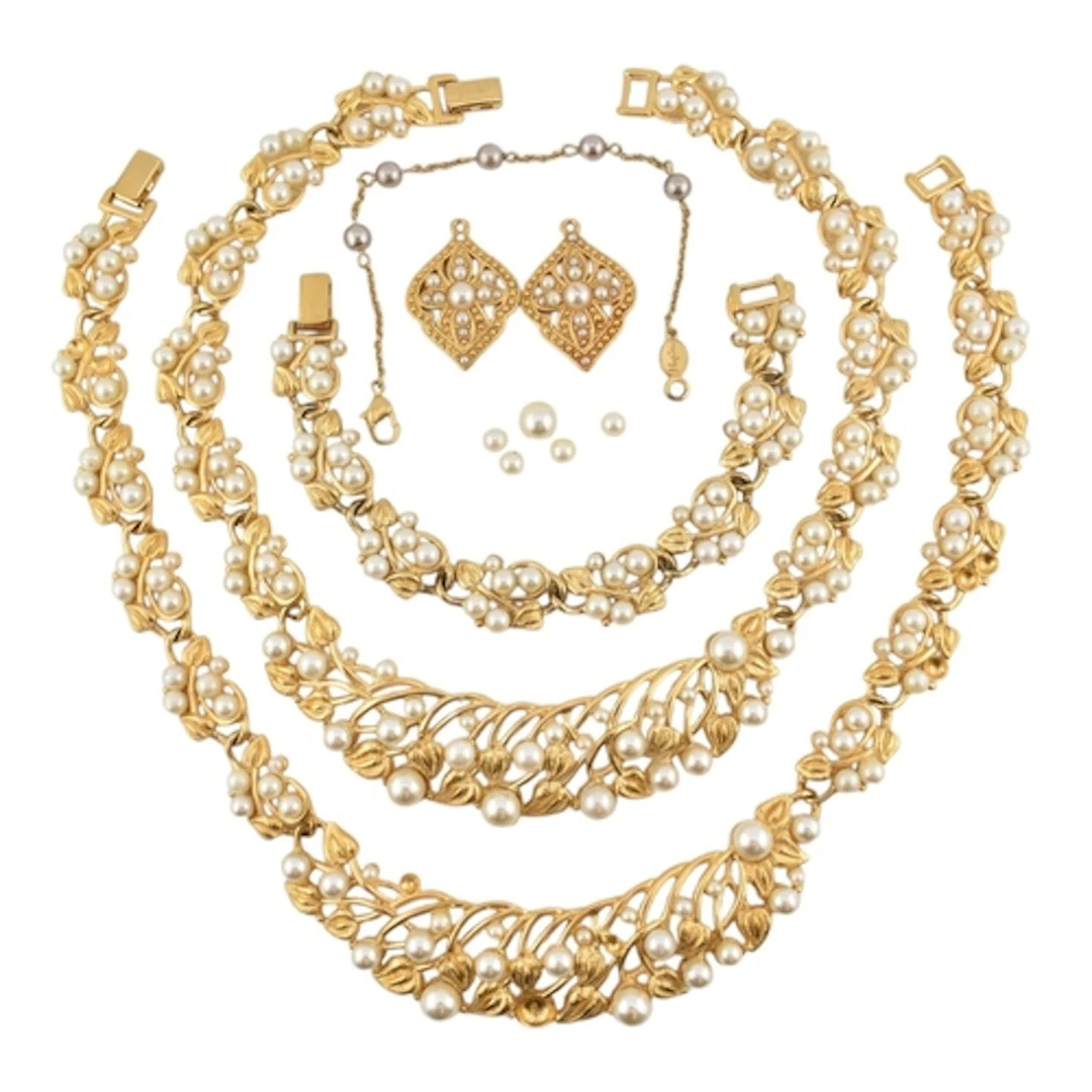 A selection of Napier gold tone simulated pearl jewellery. S...