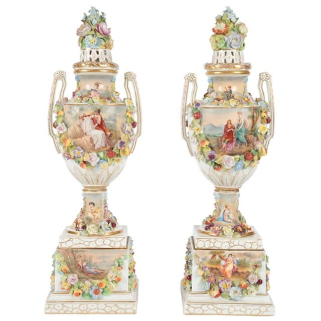 A pair of Carl Thieme of Potschappel porcelain urns, covers ...