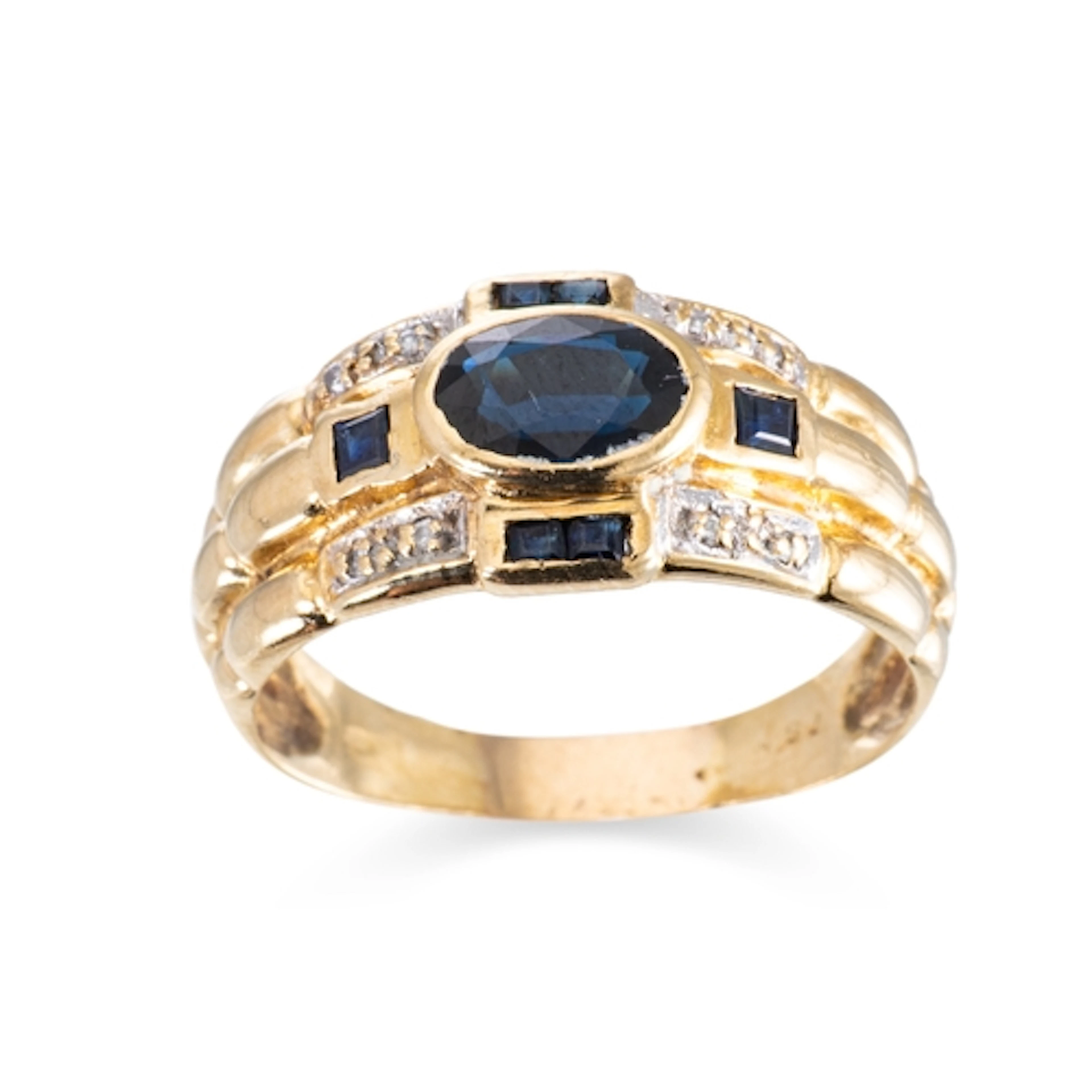 A SAPPHIRE AND DIAMOND DRESS RING, the central oval sapphire...