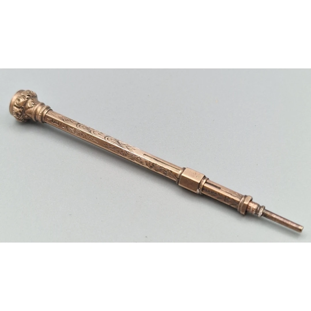 9ct gold engraved propelling pencil with hardstone terminal....